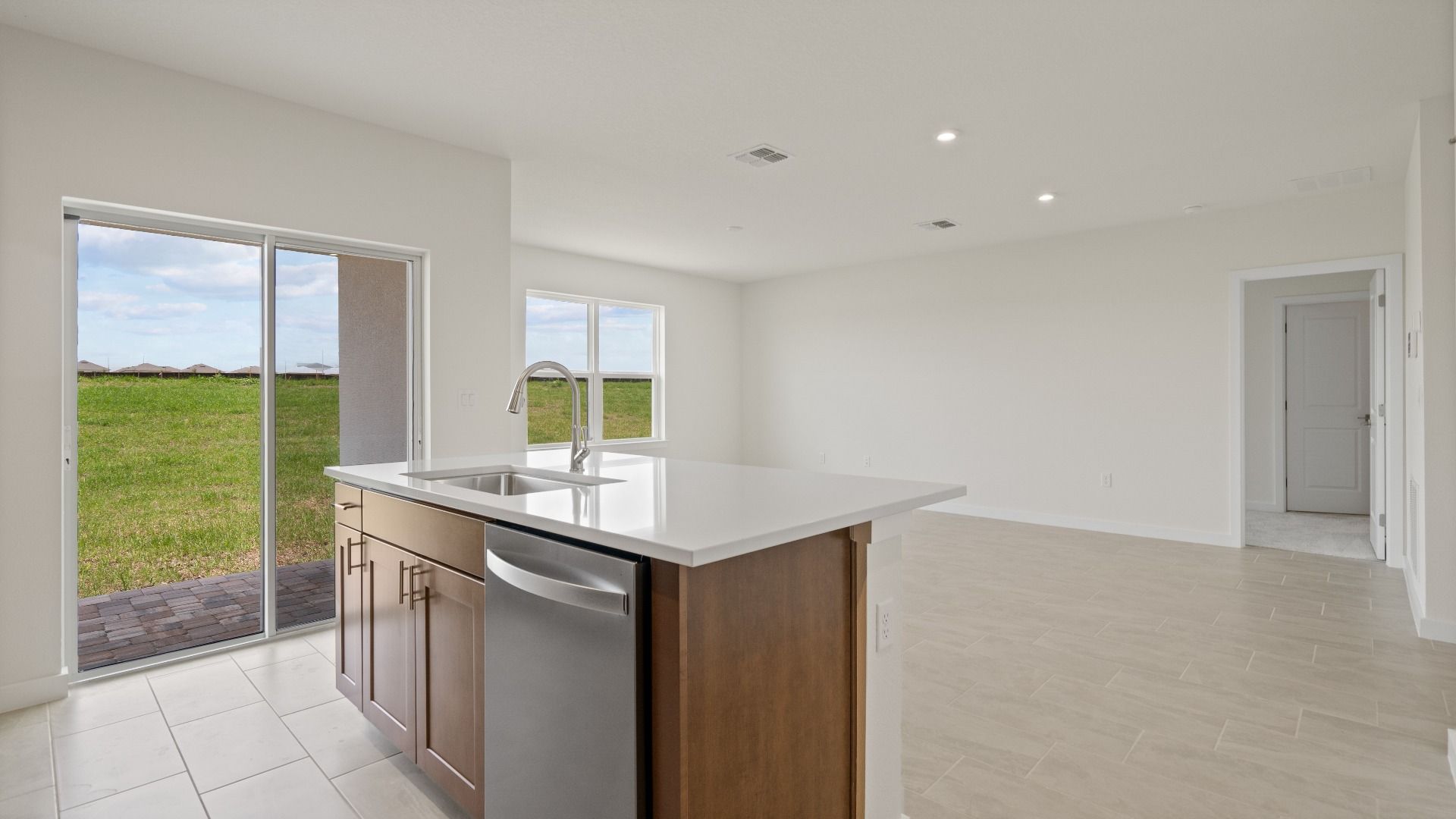 Atwood Floor Plan Kitchen and Living Area by DRB Homes in Liberty Trace New Homes in Haines City, FL