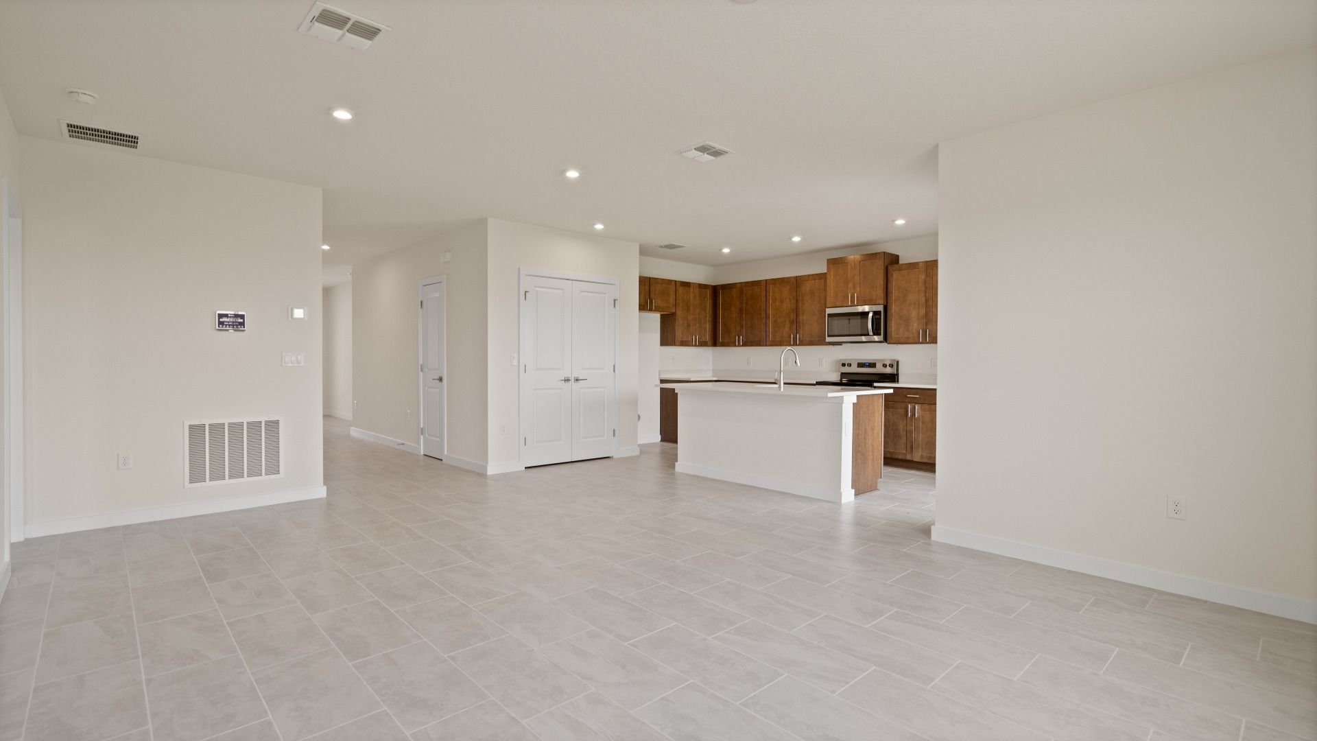 Atwood Kitchen and Living Area by DRB Homes in Liberty Trace New Homes in Haines City, FL