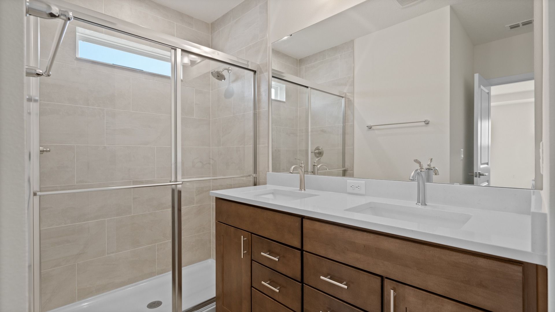 Atwood Floor Plan Second Bathroom with Glass Shower by DRB Homes in  Liberty Trace New Homes in Haines City, FL