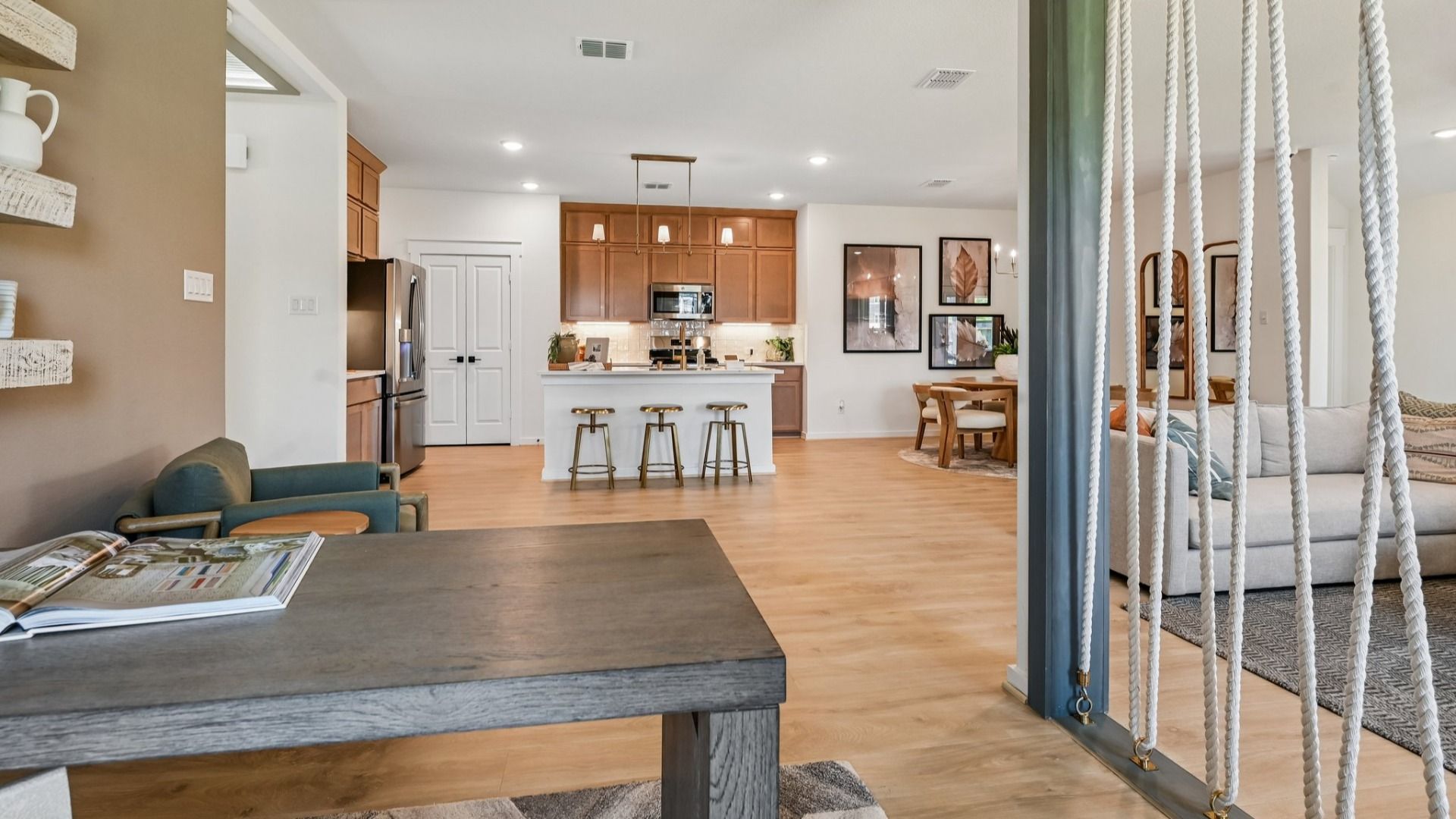 Discover elegant wood flooring and sophisticated light fixtures in Cielo's luxurious open-plan interior.