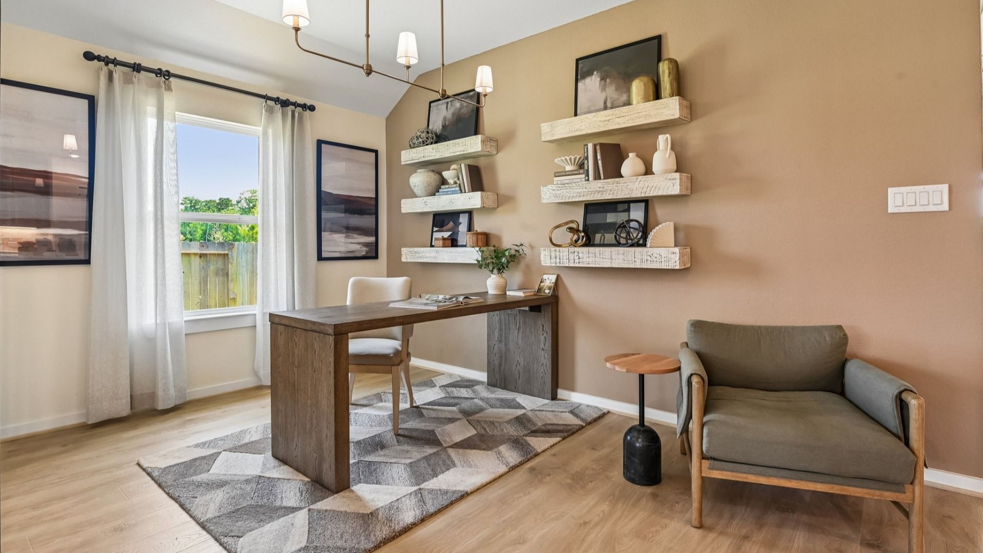 Discover modern elegance in Cielo. Features include sleek shelving, abstract rug, and chic chandelier.