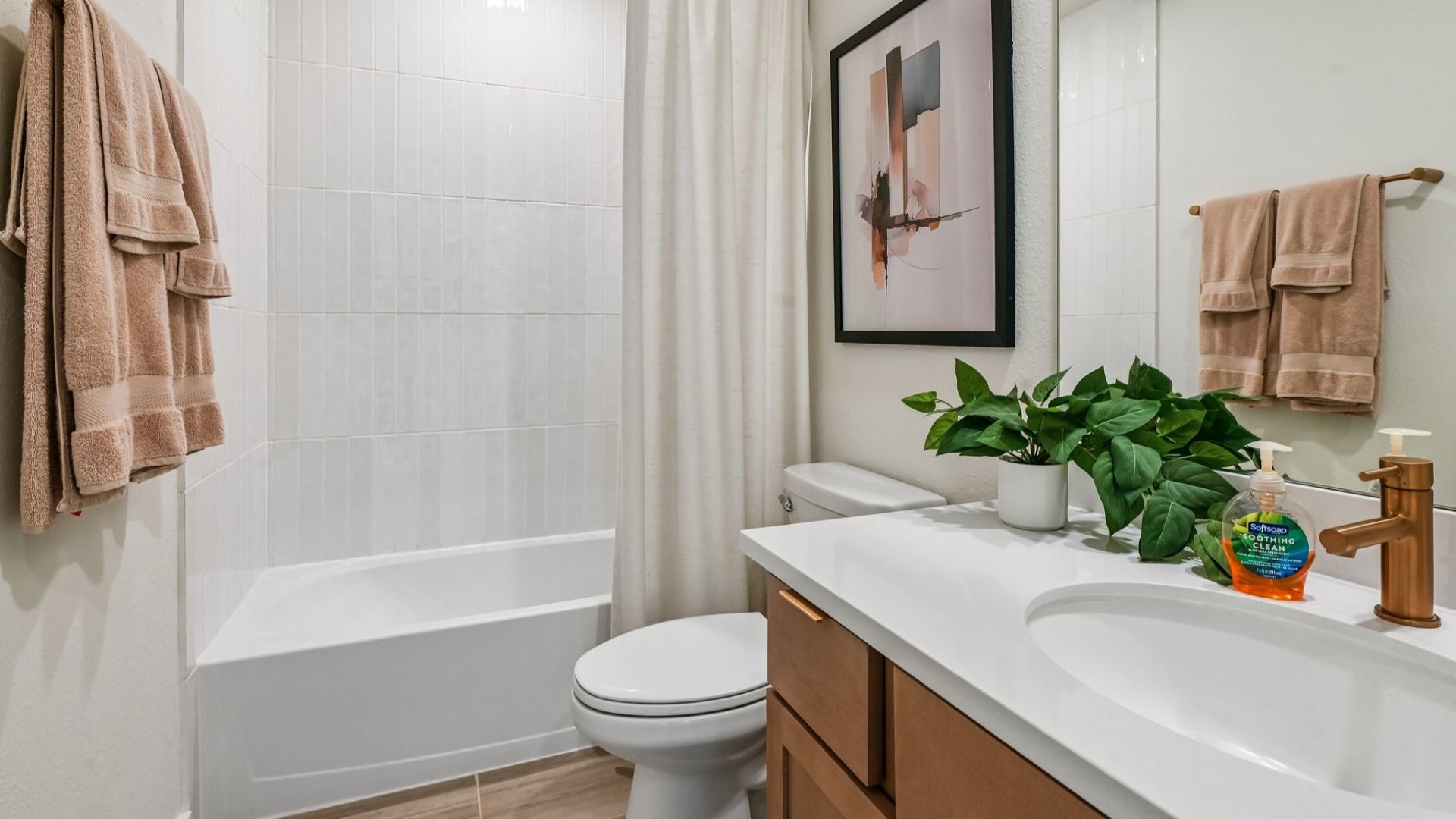 Immerse in luxury with sleek gold fixtures, refined wood accents, and contemporary design in Cielo.