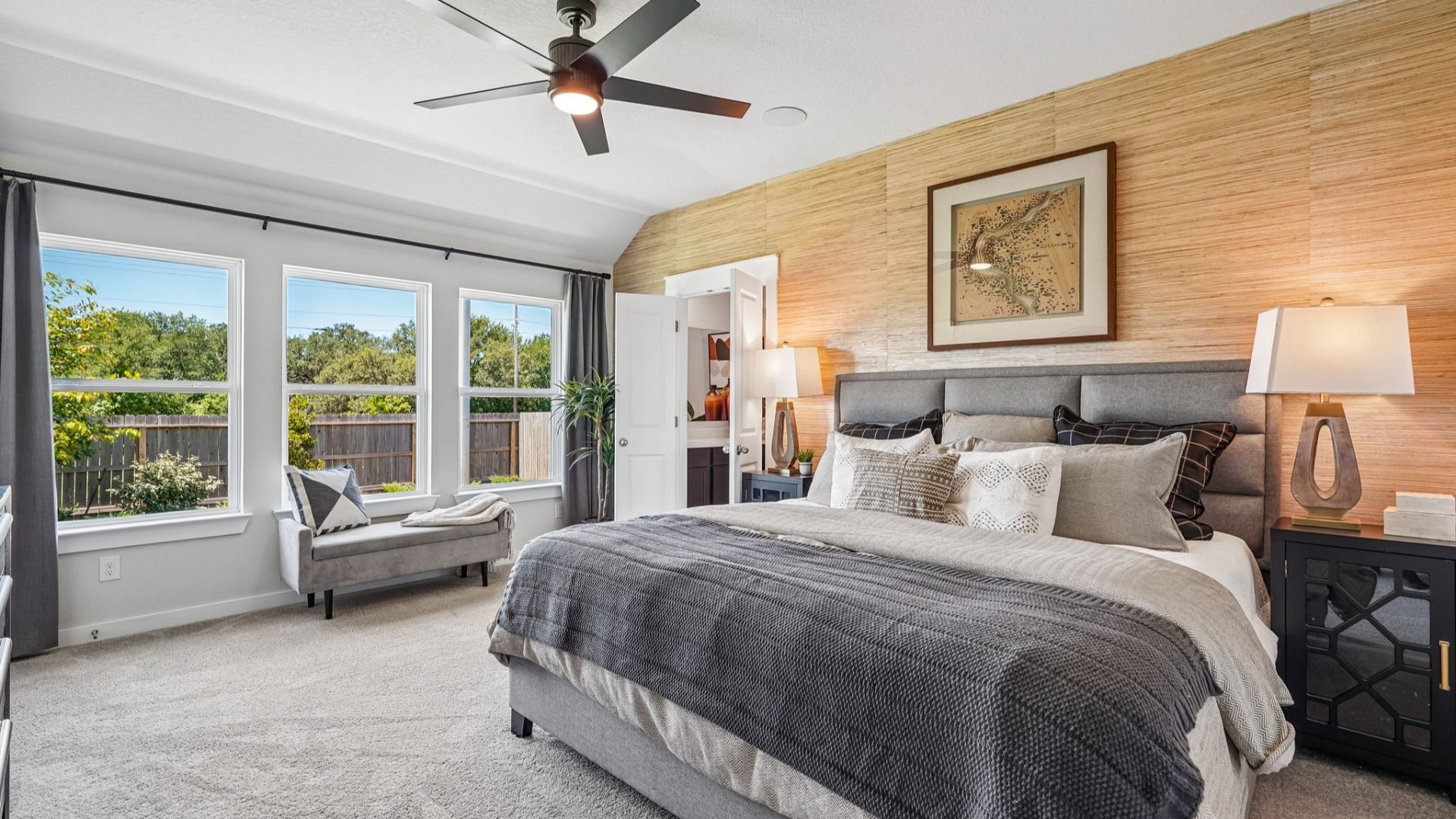 Gorgeous views of the backyard and mature trees from the Owner's Suite.