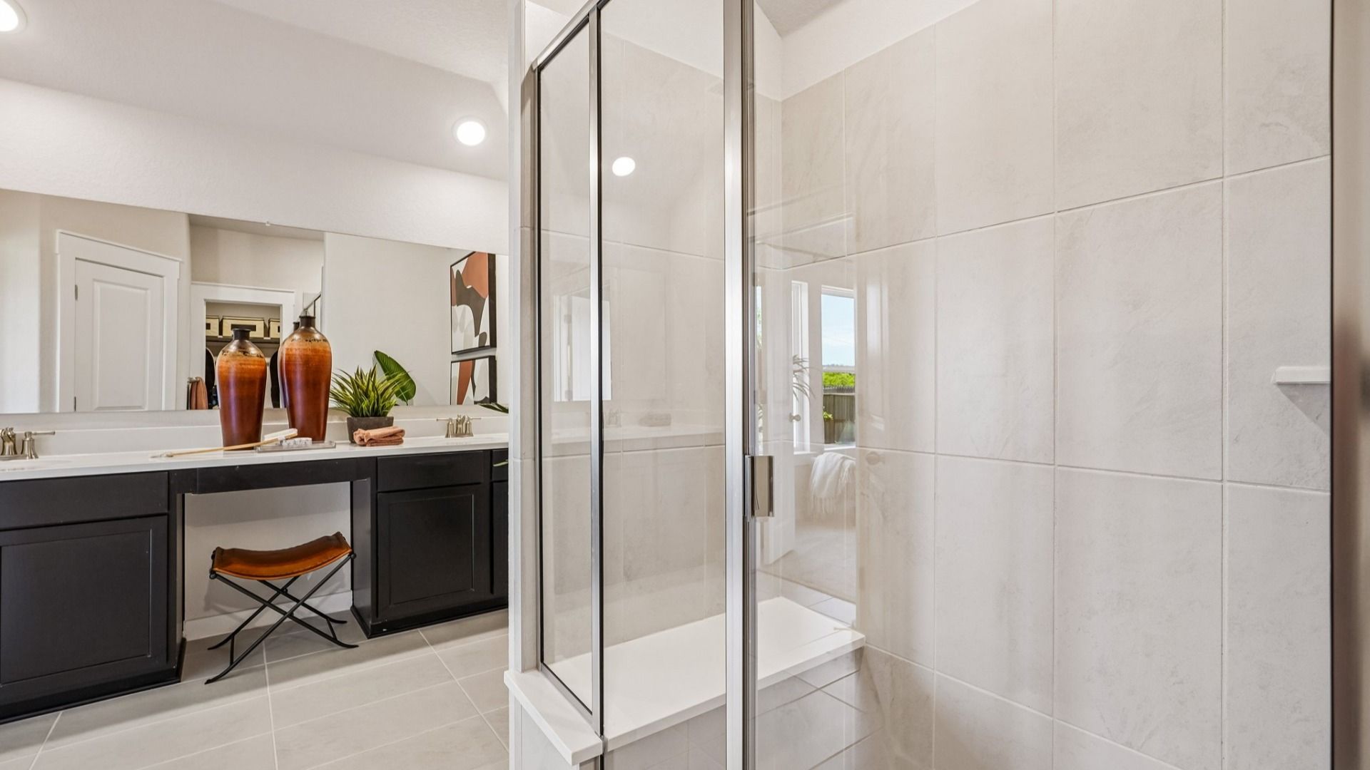Framed Glass Shower complete with marble shower seat.