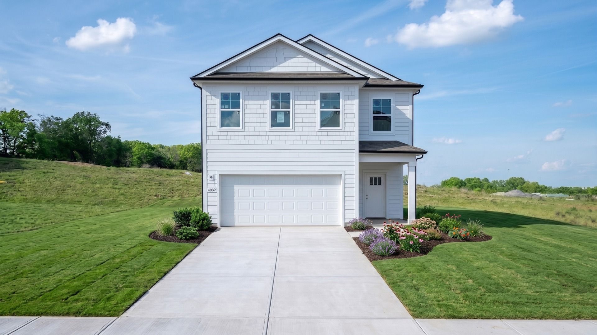 Exterior of Jasmine plan home built in Smyrna, Tn with white Hardie siding and accents