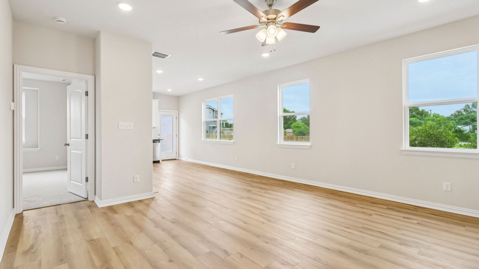 Great Room offers plenty of natural light with many large windows, and is conveniently located near the Kitchen