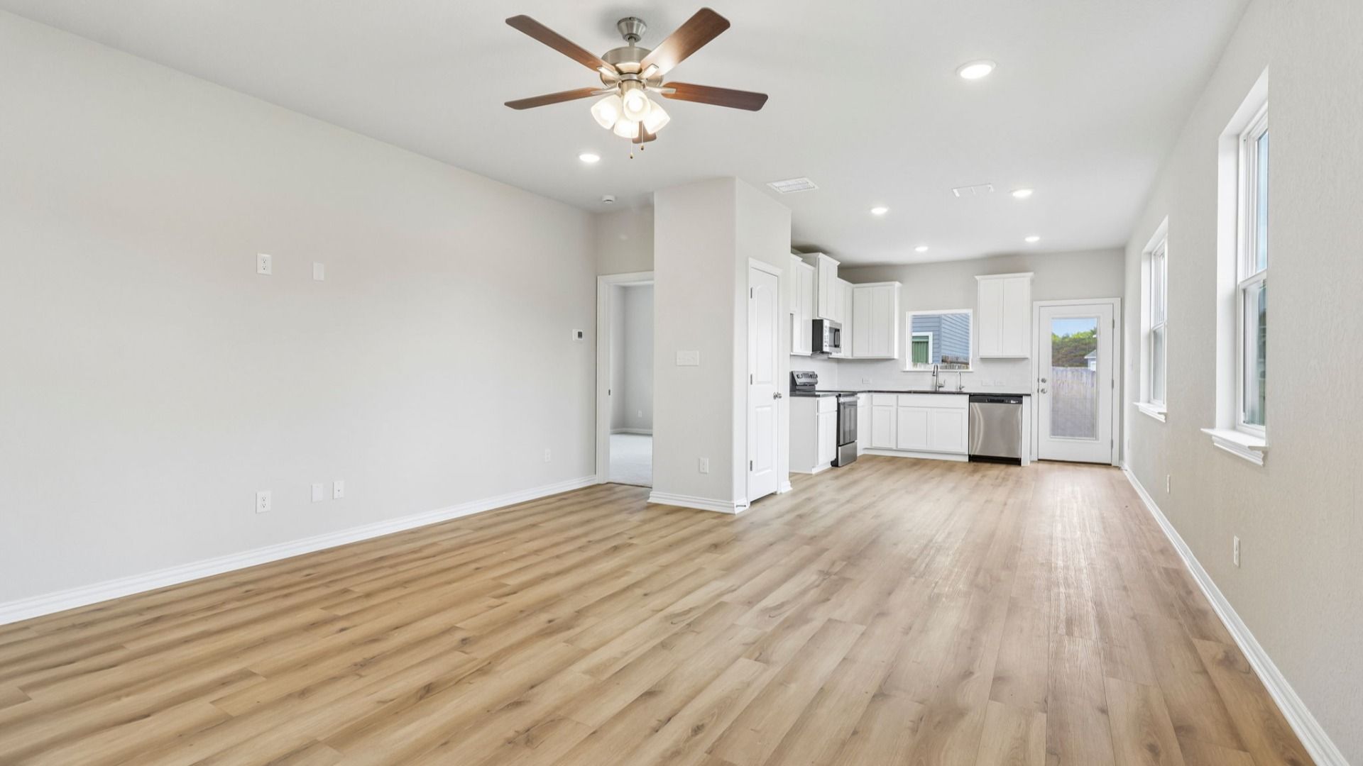 Great Room offers plenty of natural light with many large windows, and is conveniently located near the Kitchen
