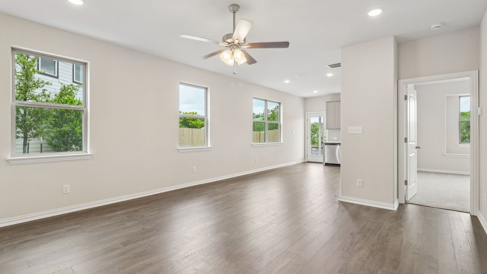 Great Room offers plenty of natural light with many large windows, and is conveniently located near the Kitchen