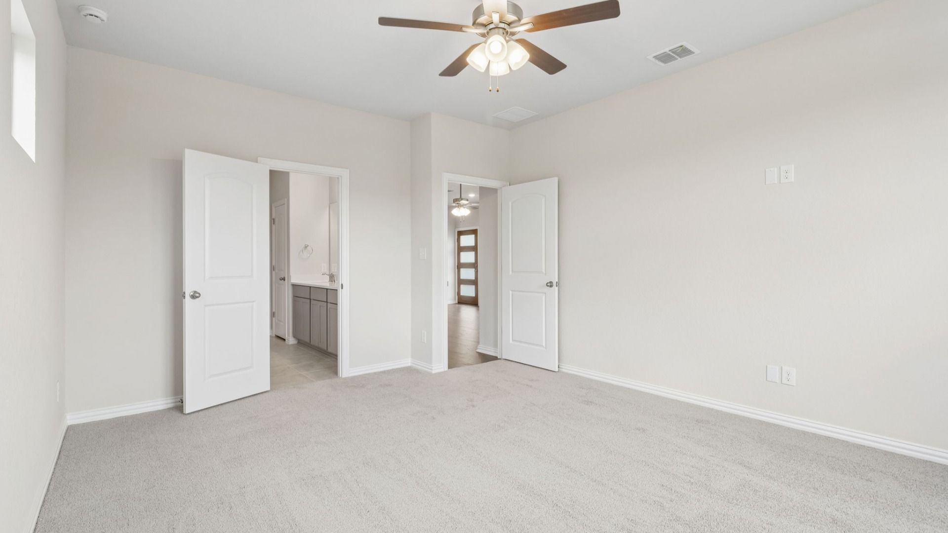 Owner's Suite has three additional windows for natural light and is located on the main level of the home