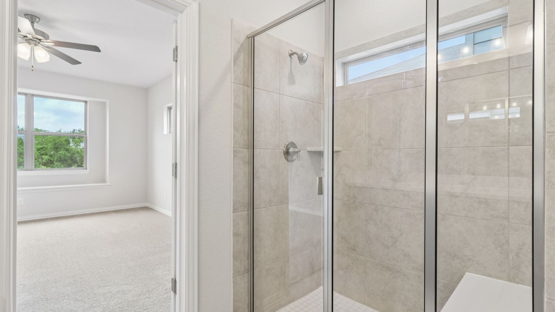 Owner's Bath has bright cabinets, dual vanity and a large shower with a window for natural light