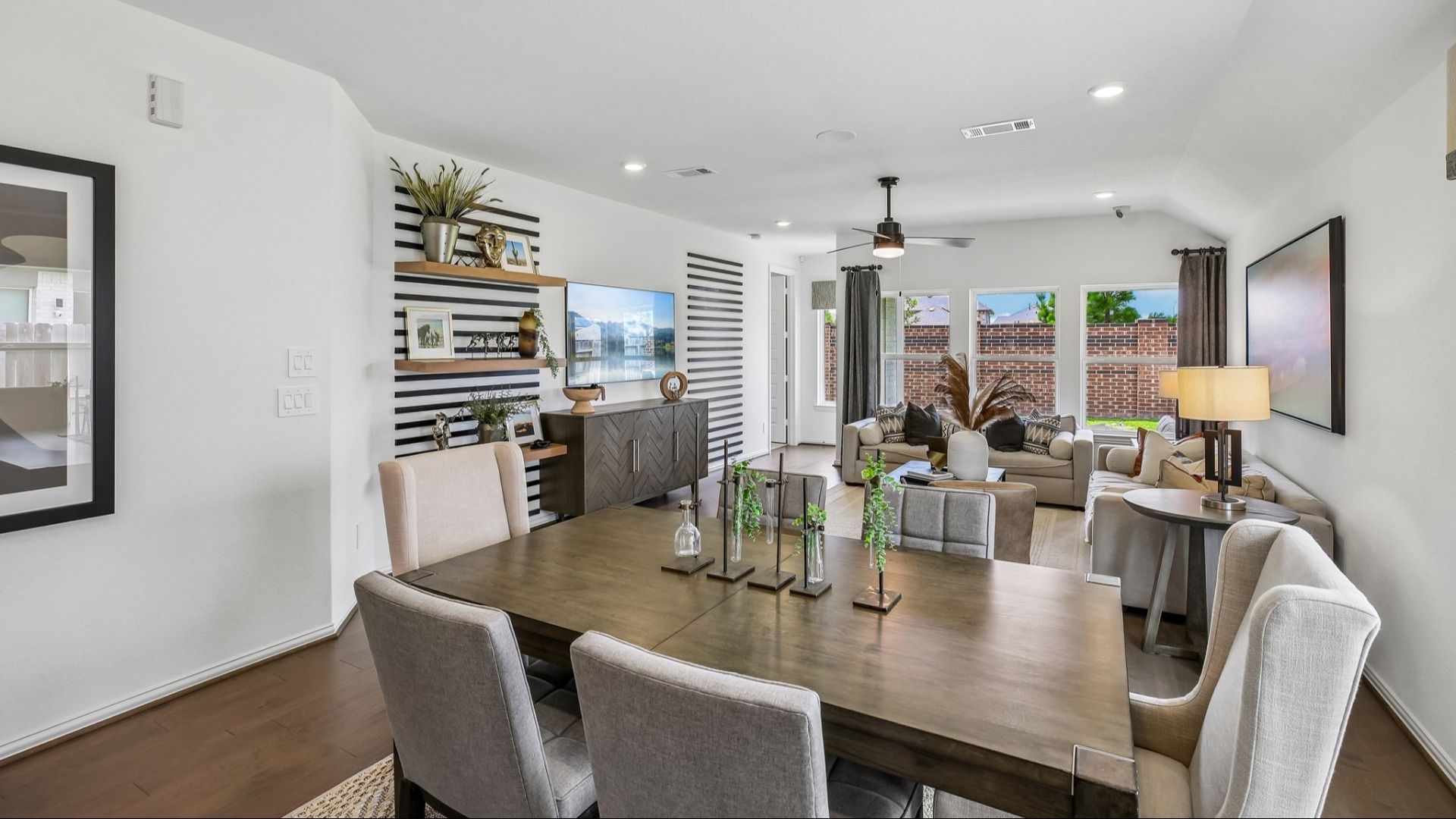 Experience refined elegance with open layout, striped wall accents, and hardwood floors in prestigious Cypress Green.