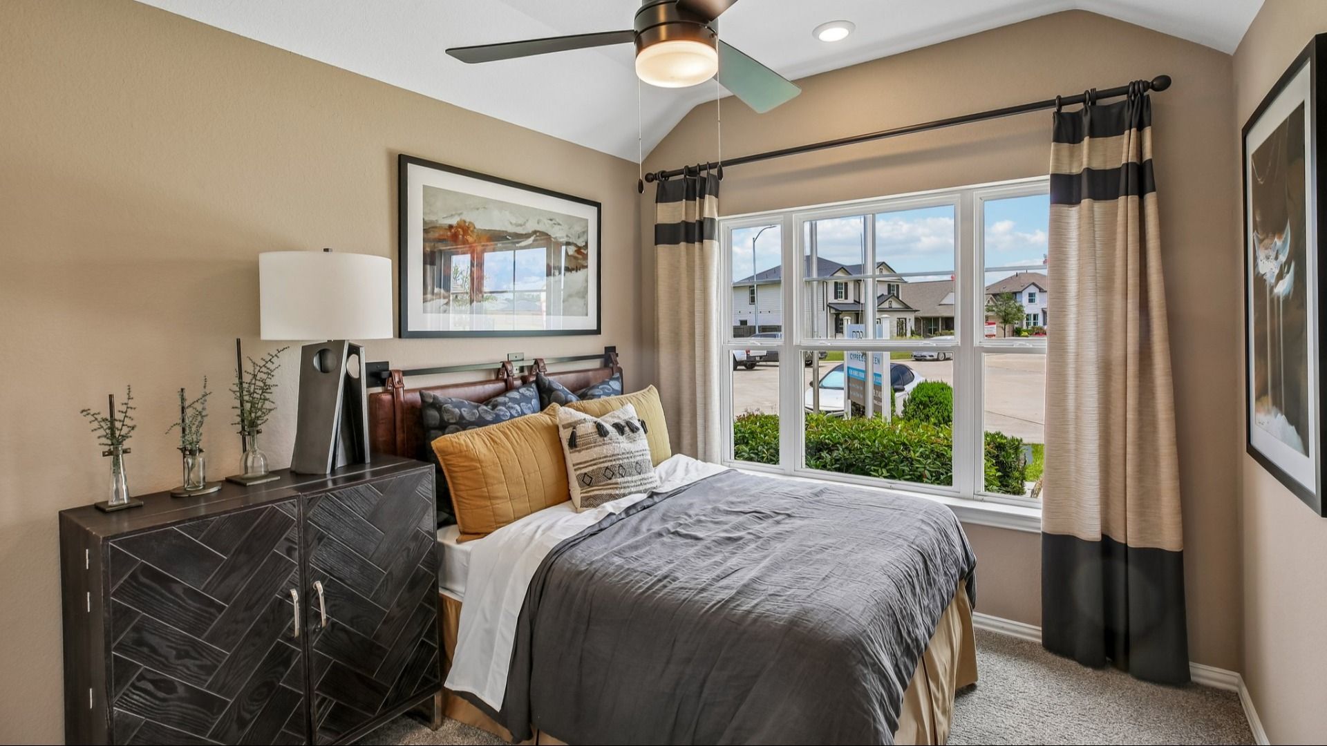 Discover refined elegance with a custom geometric dresser and expansive window views in Cypress Green.