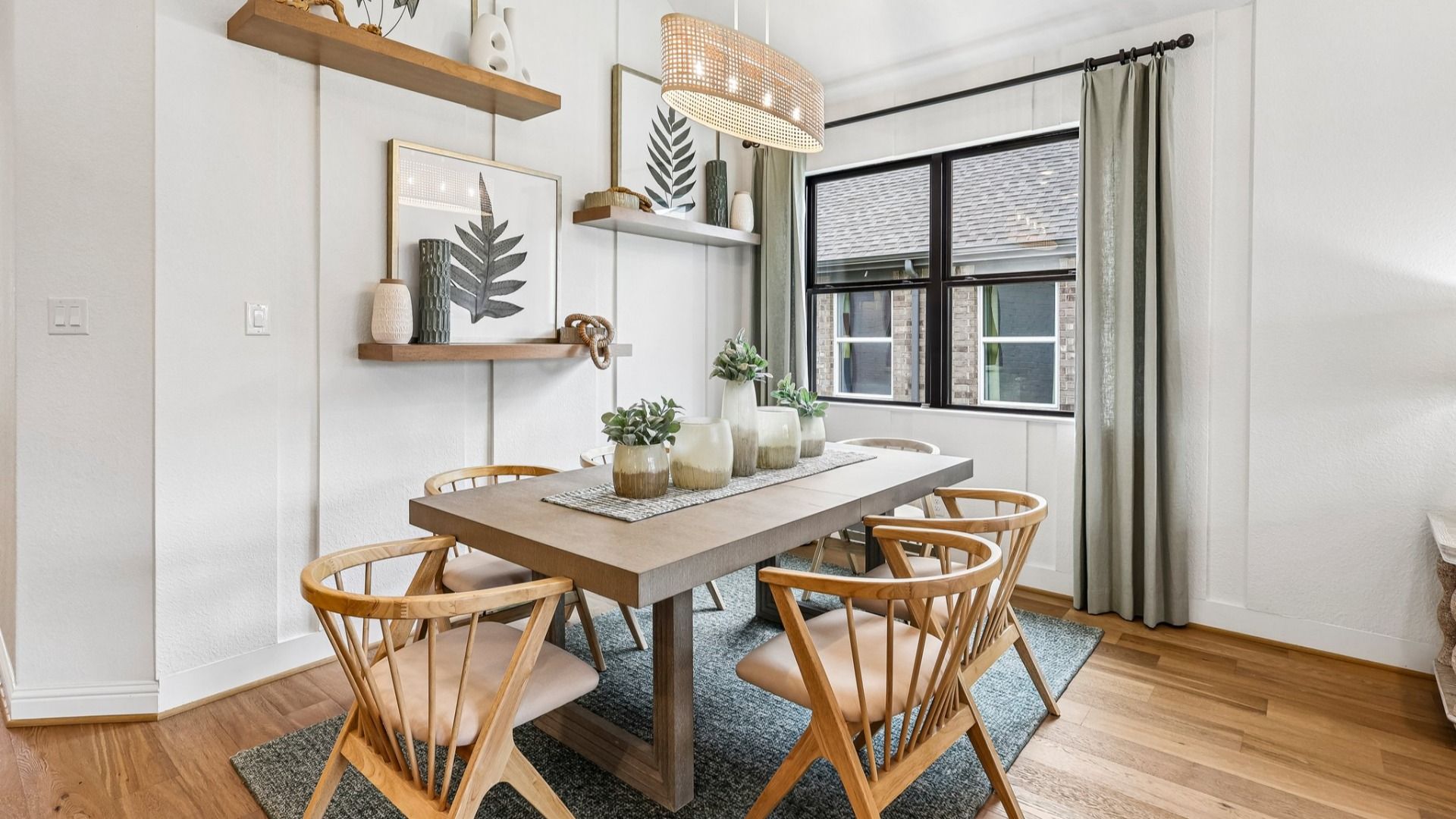 Sophisticated dining area features minimalist design, sleek wooden furniture, modern light fixture in Sunterra.