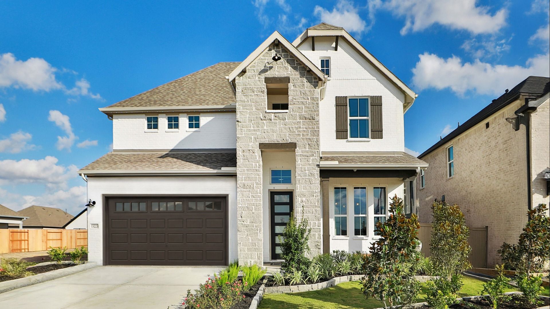 Stunning Creekhaven home with elegant brickwork, pristine stone features, and expansive windows.