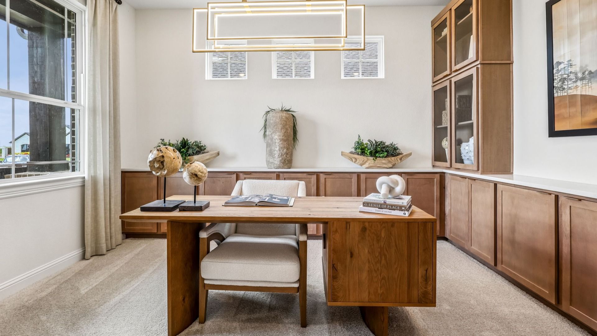 Luxurious home office with custom wood cabinetry and sleek lighting in Brookewater.