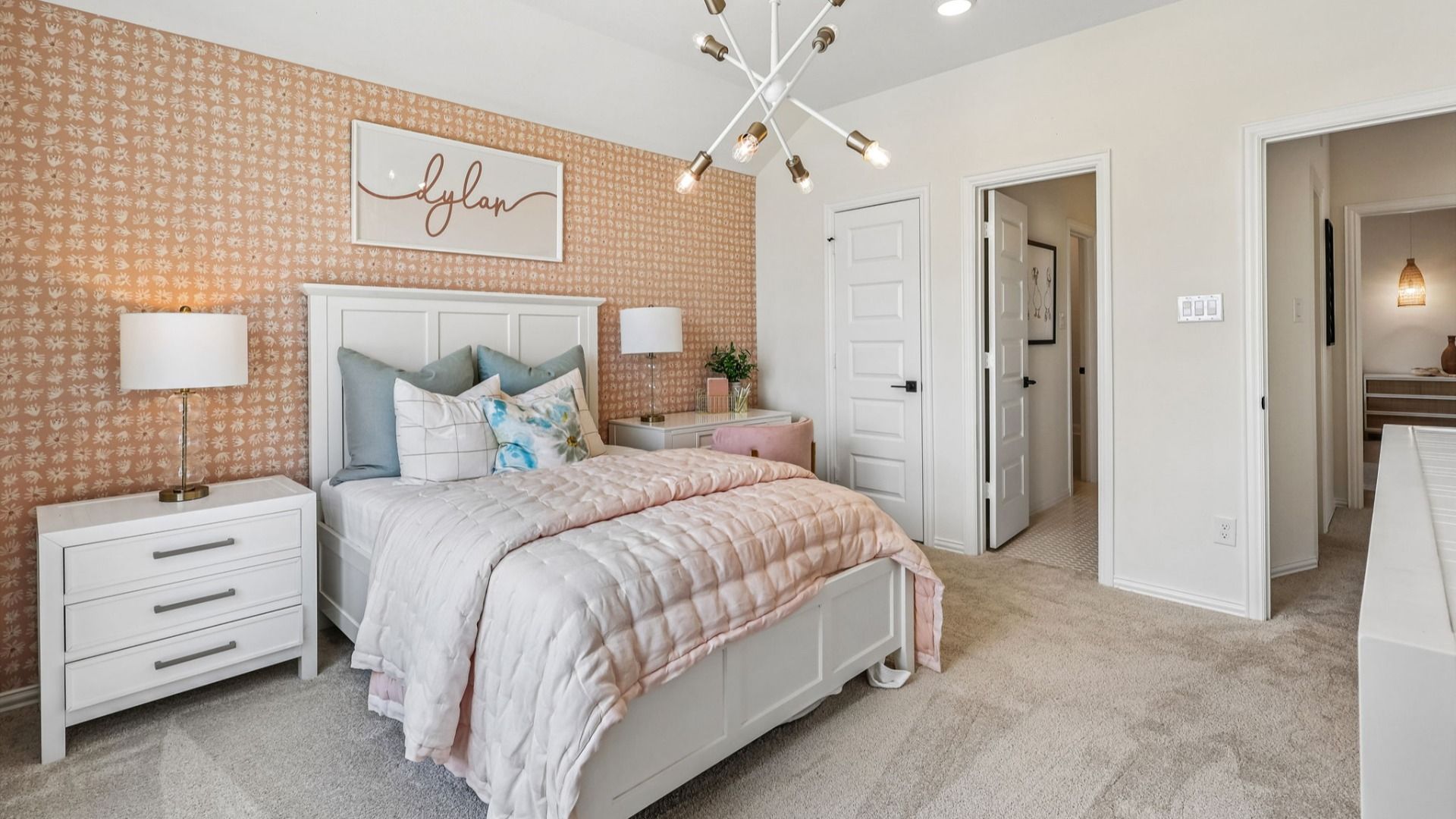 Luxurious Brookewater bedroom with chic pink decor and elegant carpeting