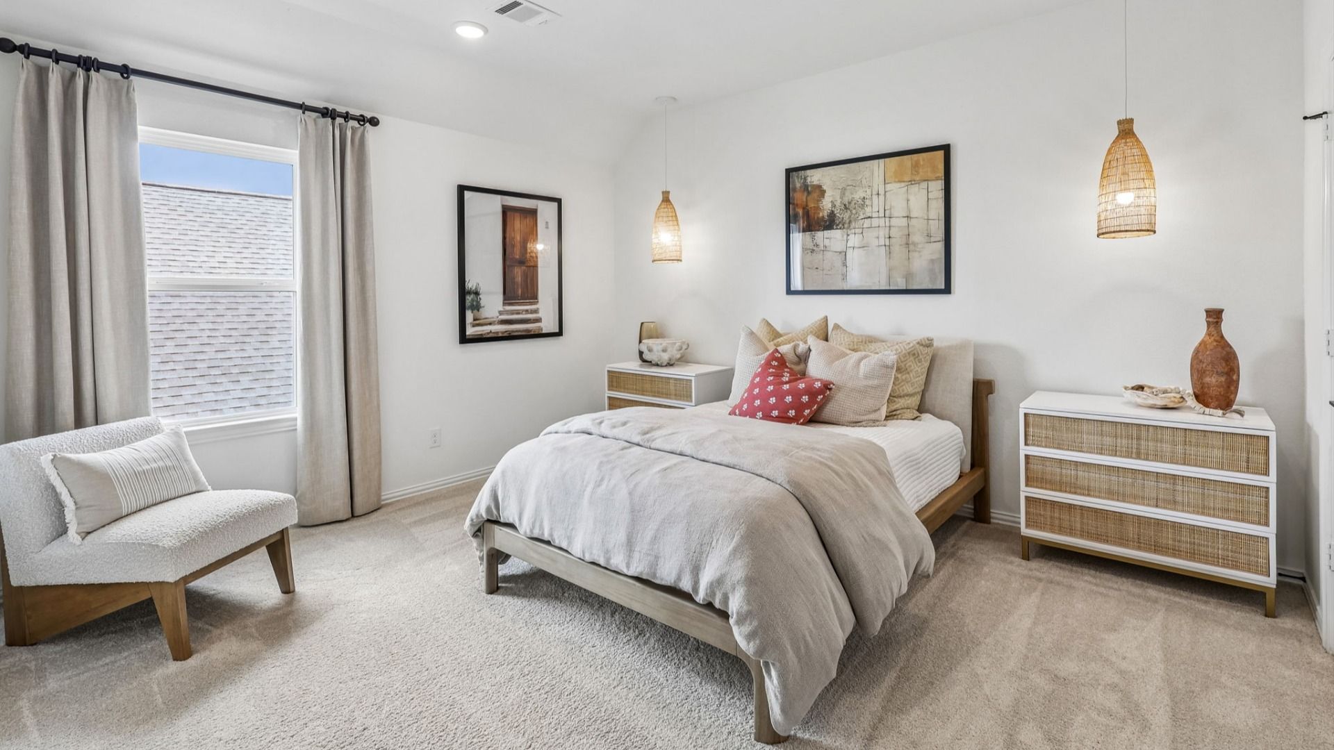 Luxurious Brookewater bedroom features elegant woven pendants, abstract art, and serene neutral palette.