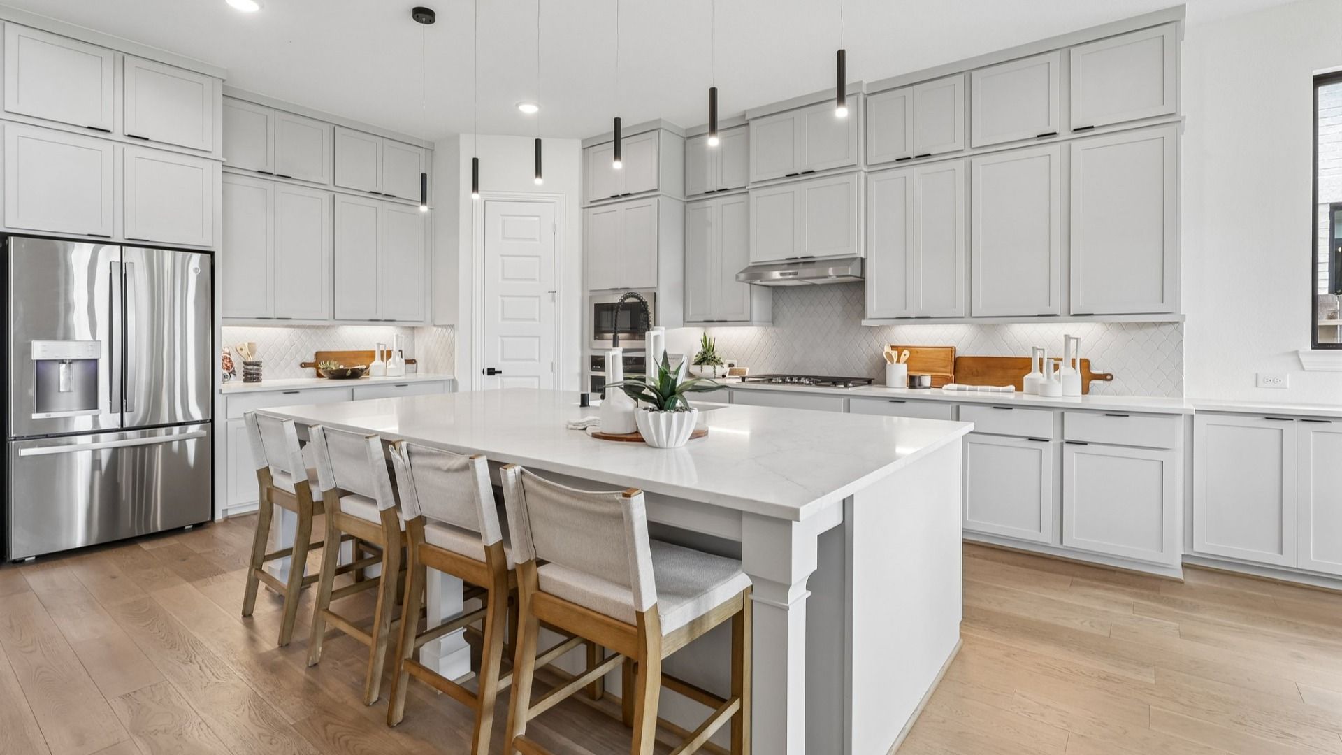 Luxurious Brookewater kitchen boasts a marble island, elegant cabinetry, and top-tier fixtures.