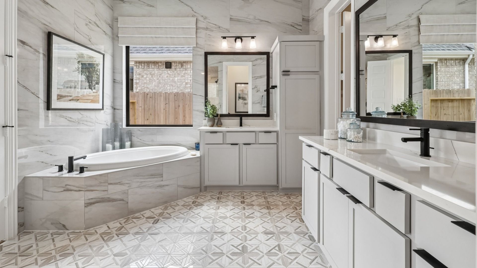 Experience refined luxury with marble tile, dual vanities, and an inviting tub in Brookewater.