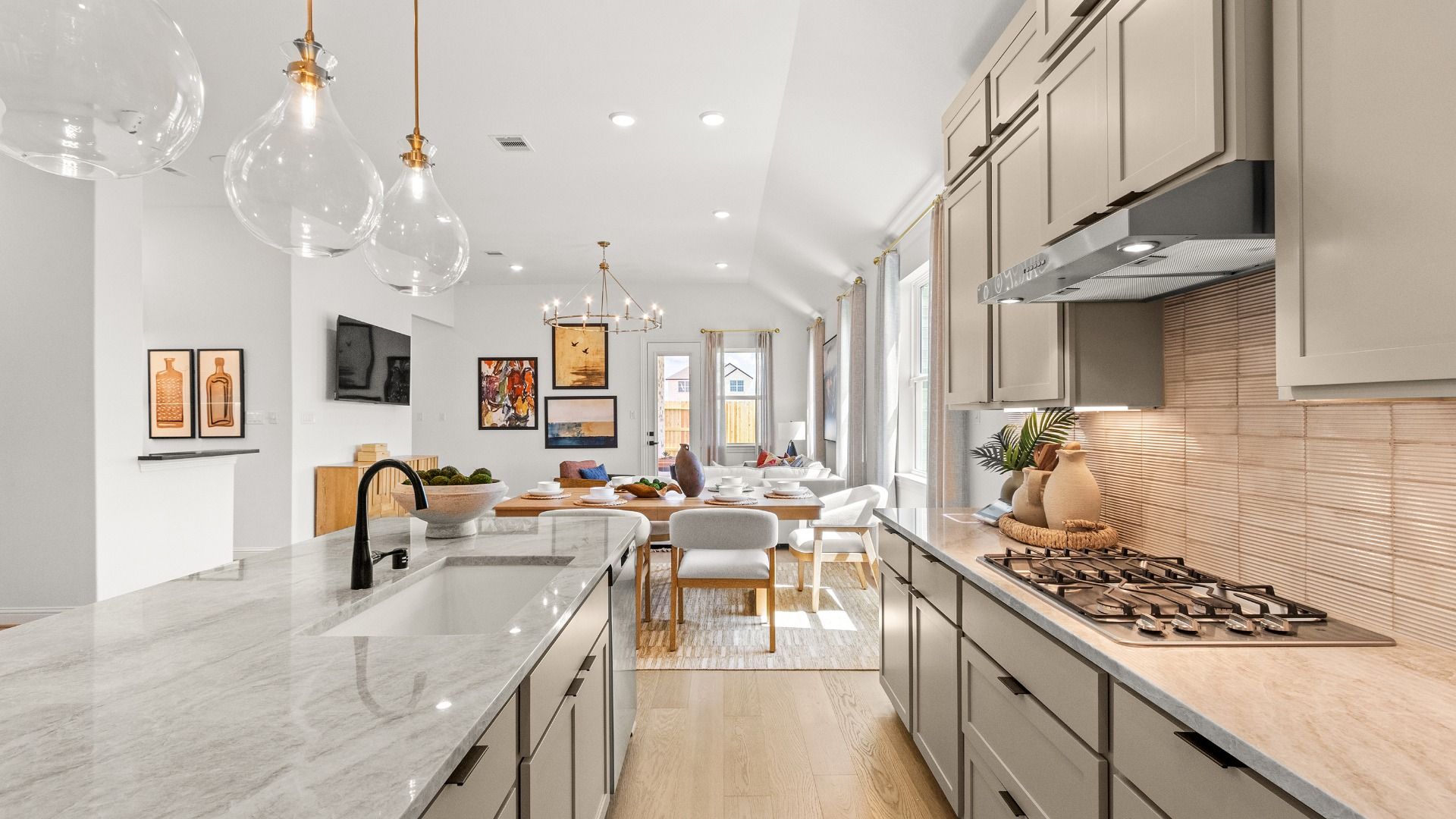 Kitchen showcasing stylish lighting, modern finishes, and an inviting atmosphere.