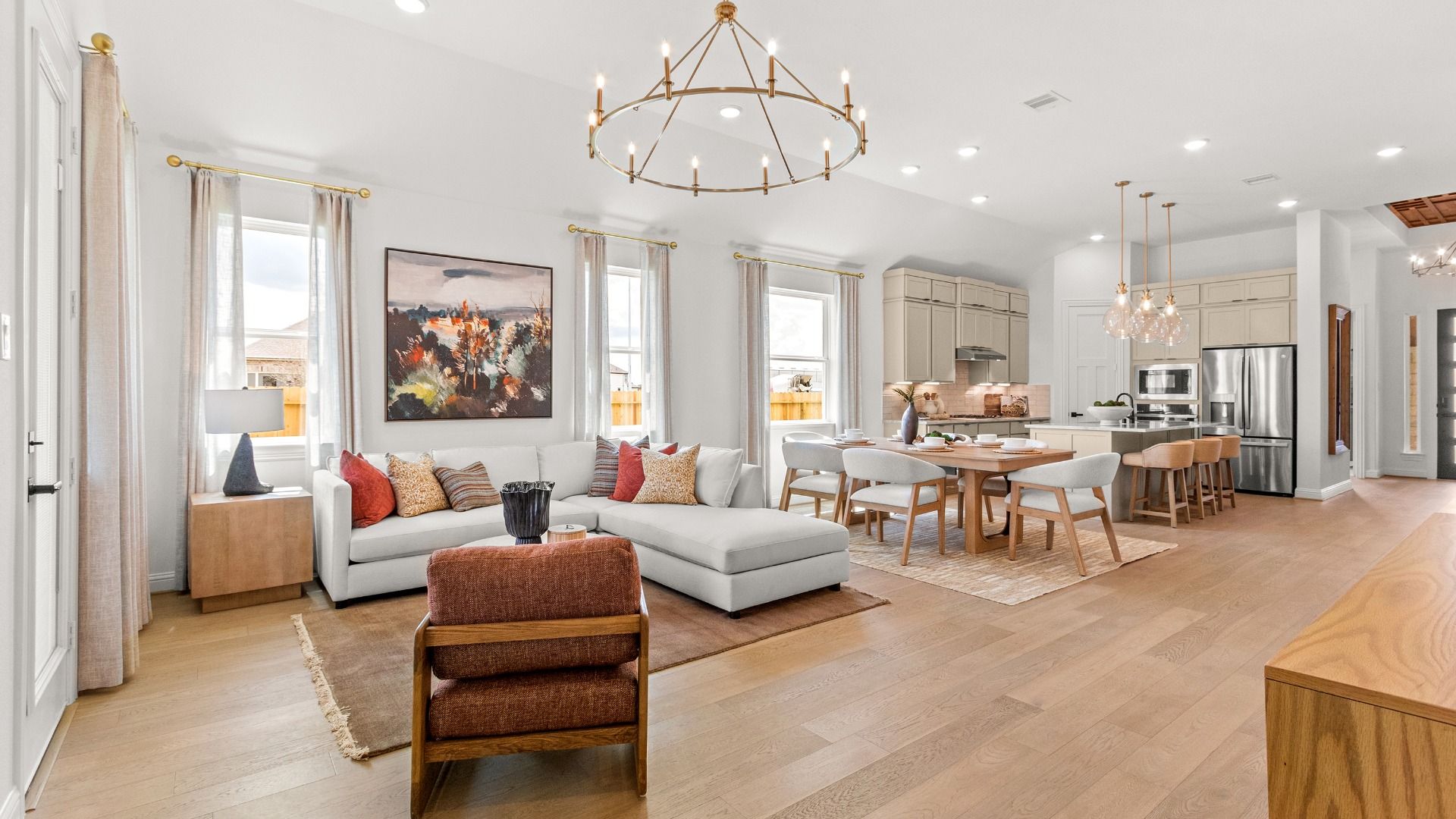 Beautiful open concept kitchen, dining, and living area featuring connected everyday living spaces in Azalea community.