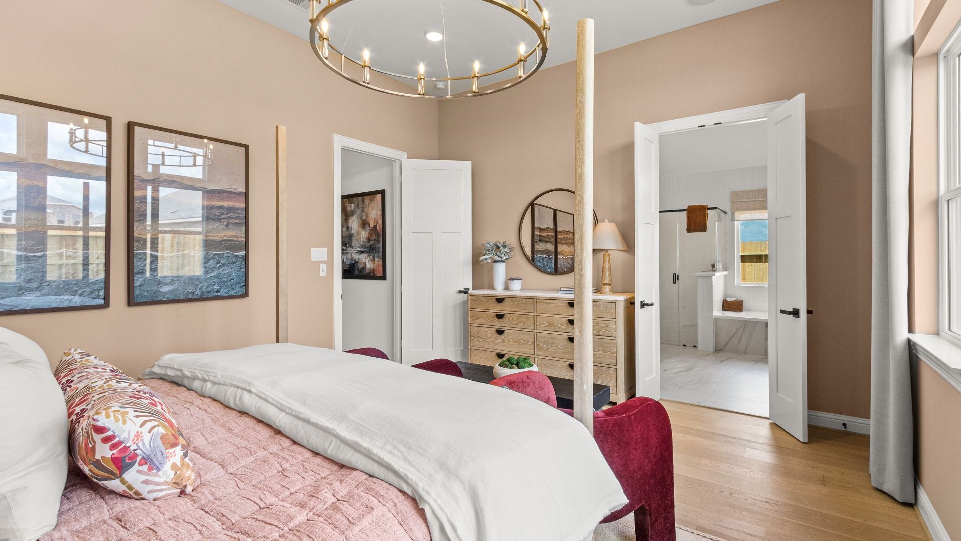 Luxurious primary suite in Azalea, where the bedroom transitions effortlessly into the spa-like ensuite bathroom.