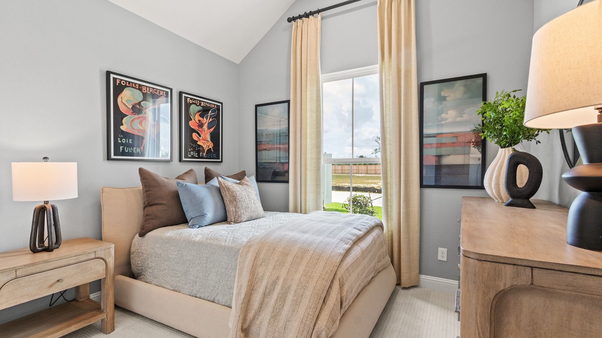 Natural light and tasteful decor create a warm, inviting atmosphere in this secondary bedroom.