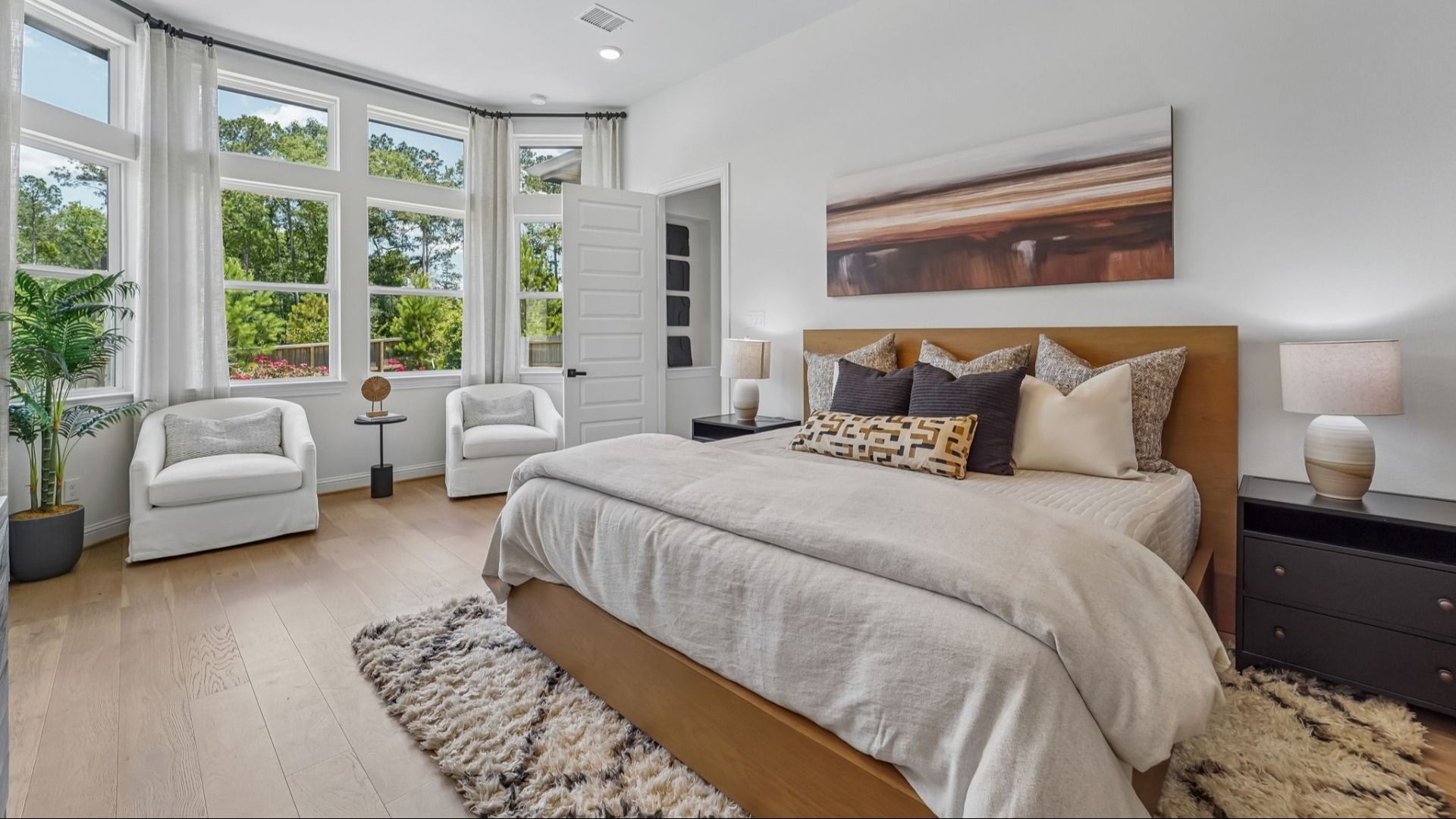 Discover expansive bay windows and sophisticated decor in this Woodlands Hills sanctuary.