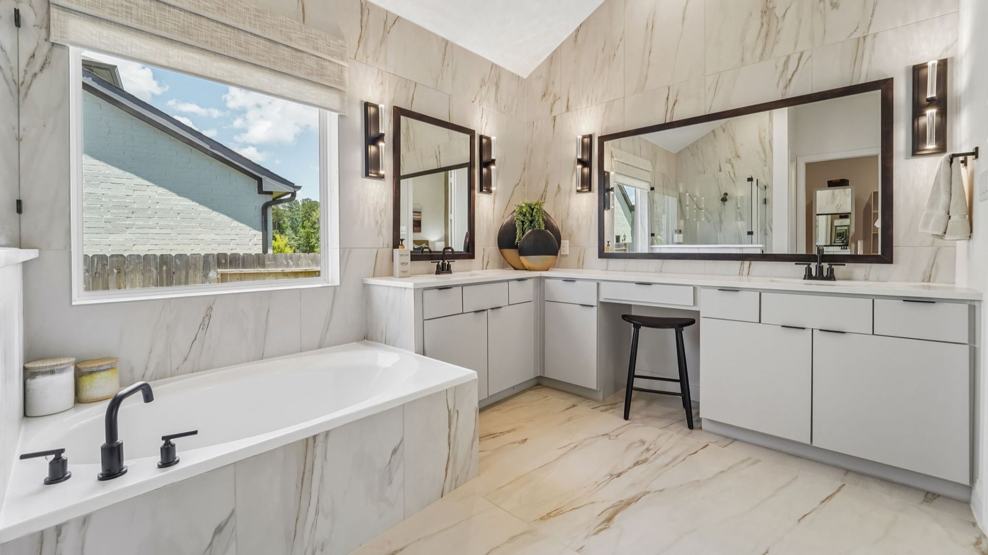Revel in marble elegance and modern fixtures in Woodlands Hills' sophisticated bathroom design.