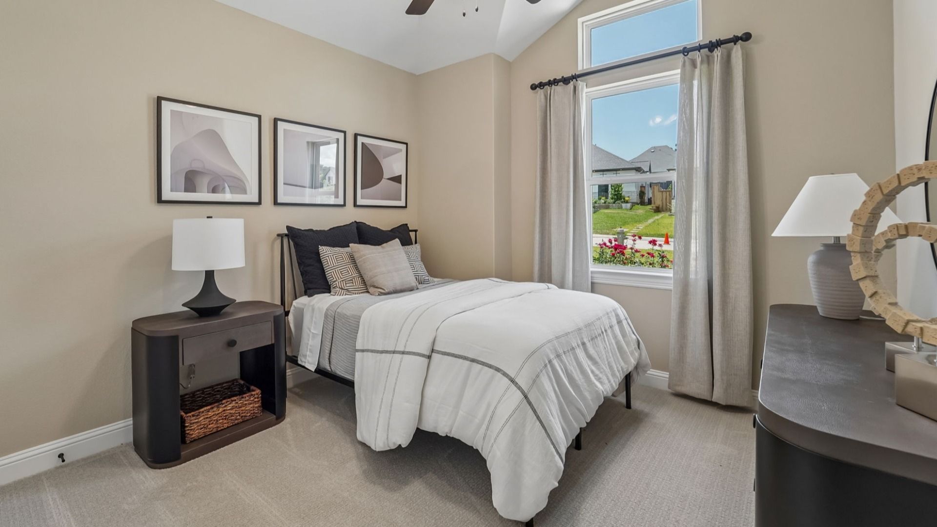 Discover minimalist elegance with high ceilings and sophisticated art in The Woodlands Hills.