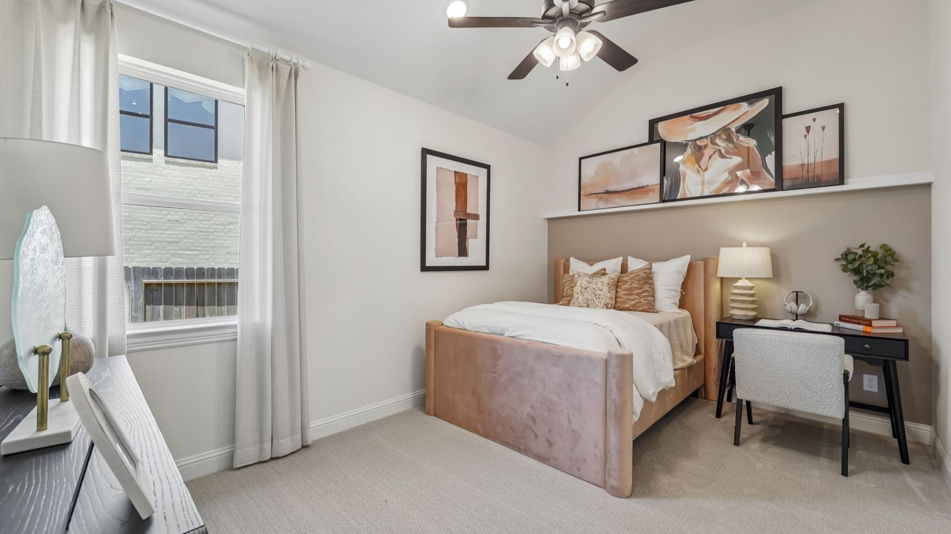 Experience refined comfort with plush textures and sleek art in this Woodlands Hills bedroom.