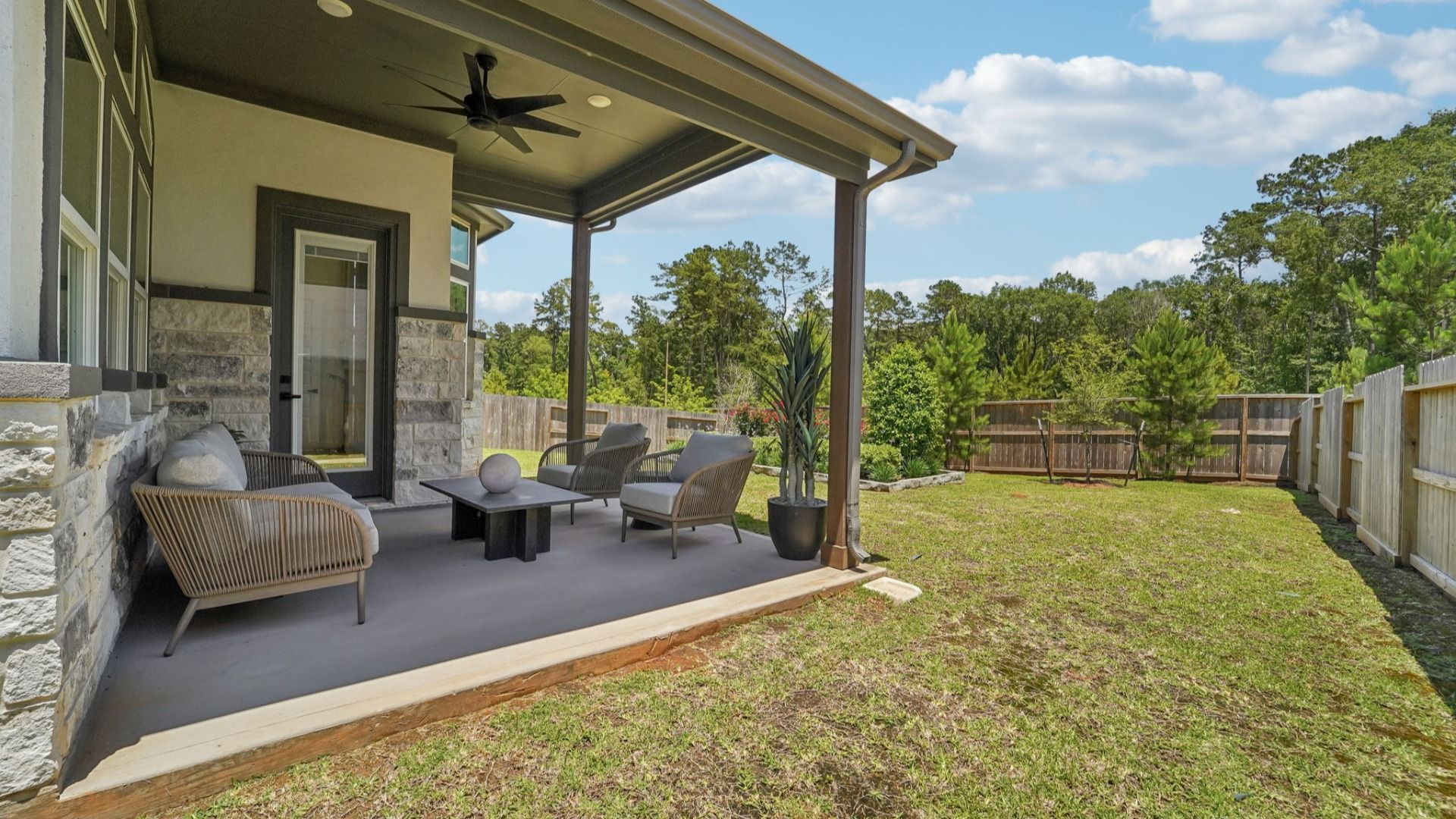 Discover refined elegance with a vast patio and pristine lawn in The Woodlands Hills.