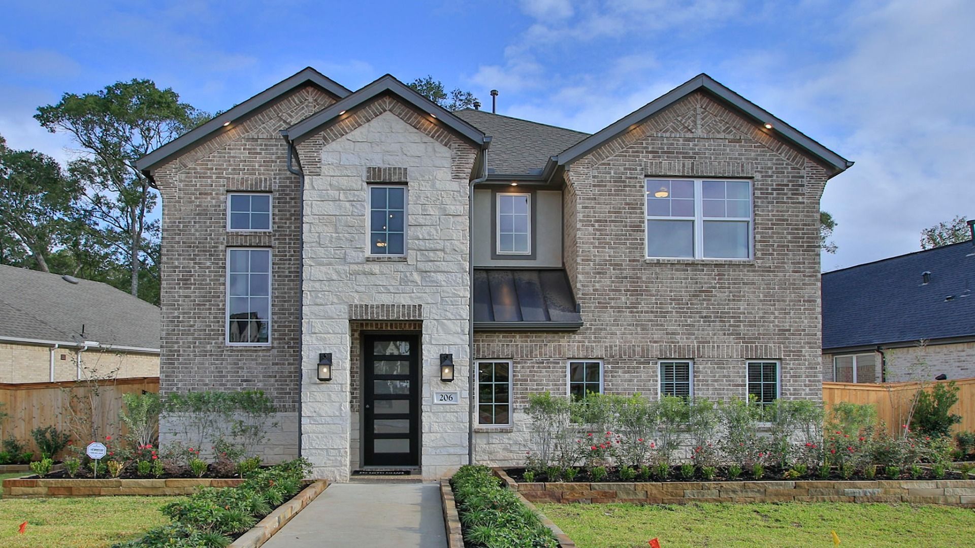 Elegantly designed with a striking stone facade, this Woodlands Hills home offers luxury and modern sophistication.