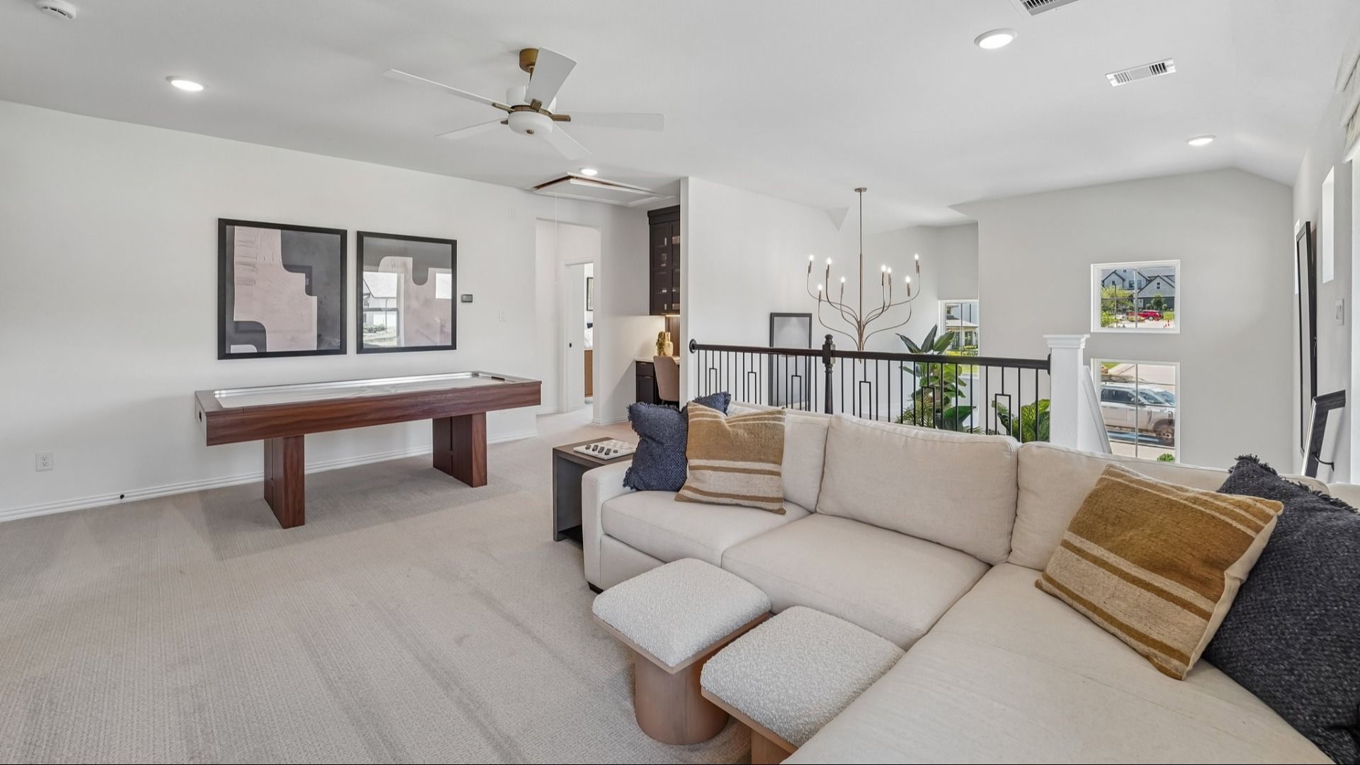 Immerse in luxury with sleek modern furnishings, pristine finishes, and a chic game table in The Woodlands Hills.