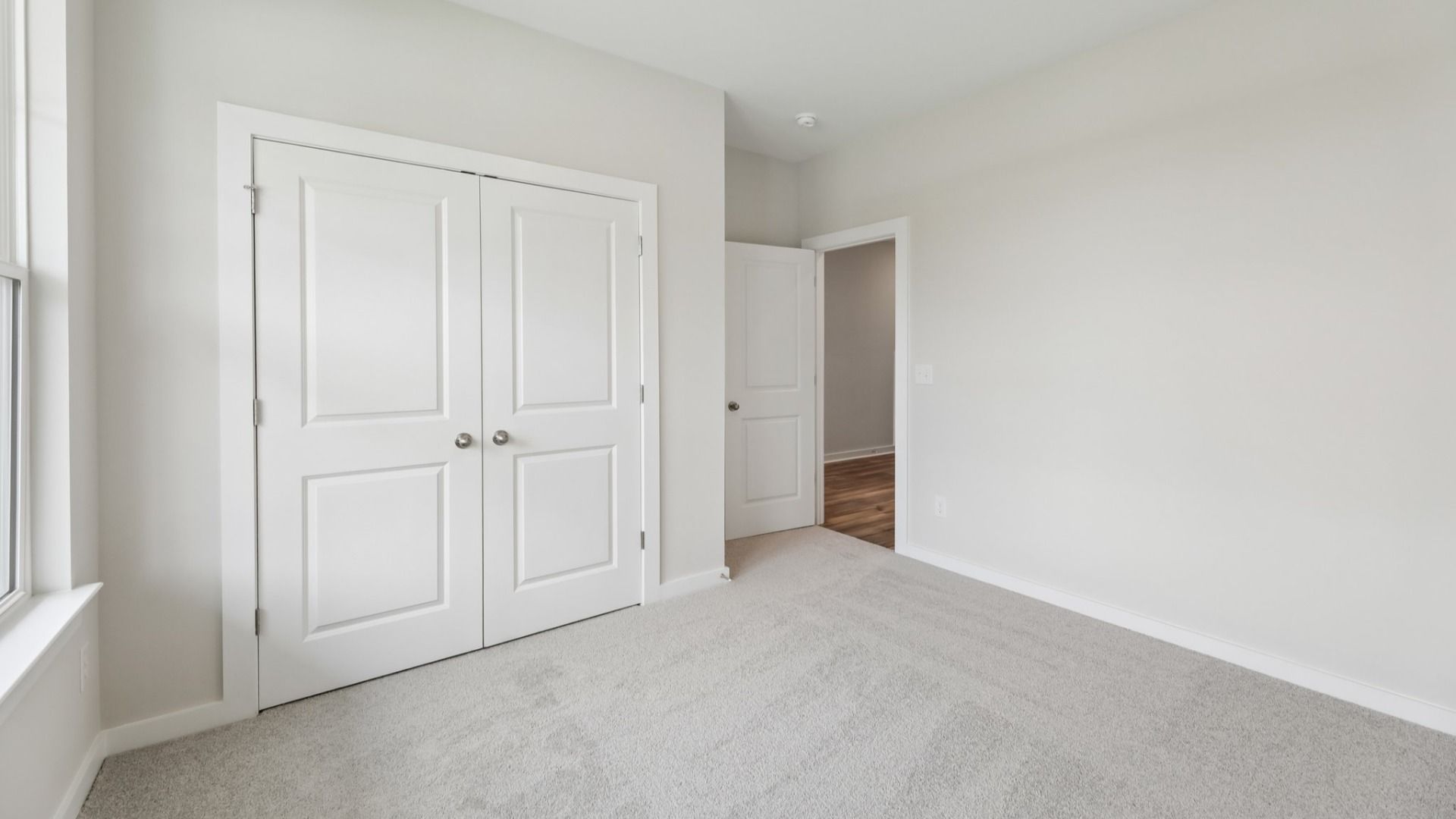 Bedroom with closet and carpet