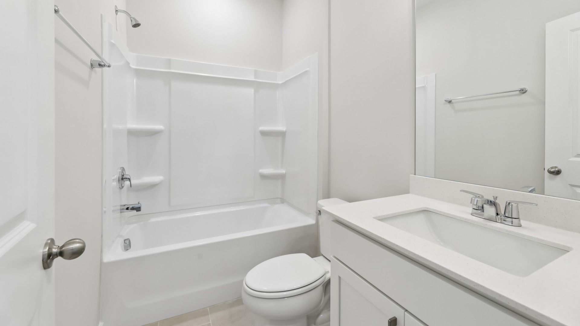 Bathroom with shower and hard surface flooring