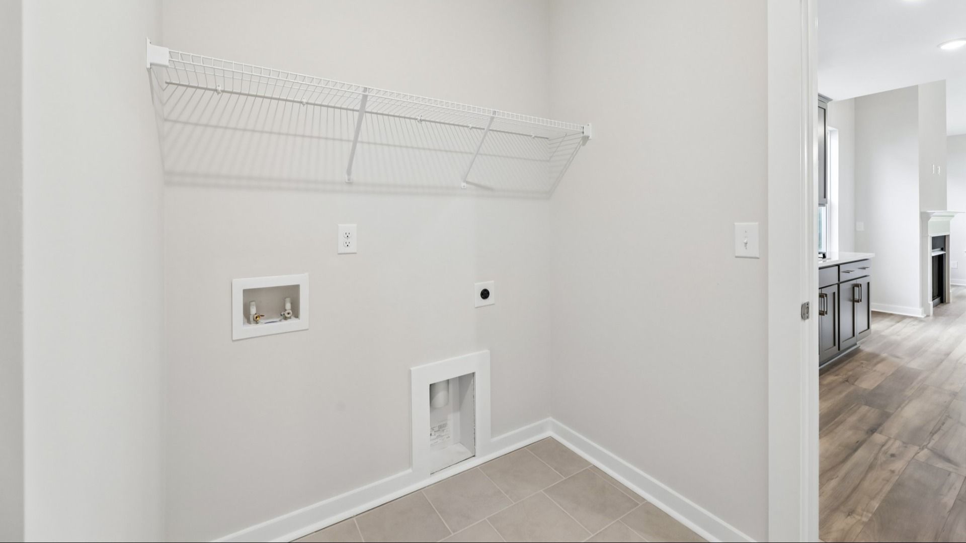 Dedicated Laundry Room with ventilated shelf