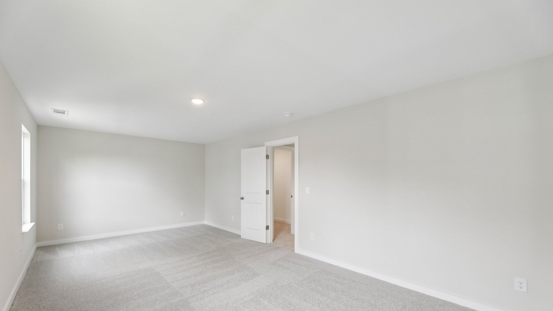 Storage room with windows and carpet