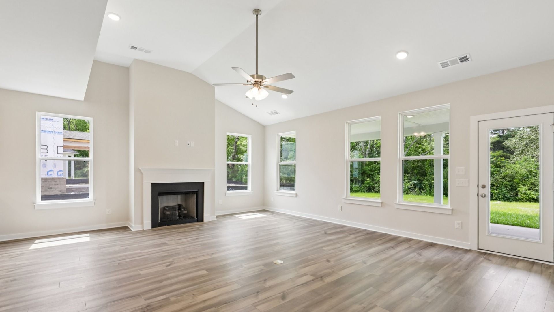 Gathering room with high ceilings and natural light from windows