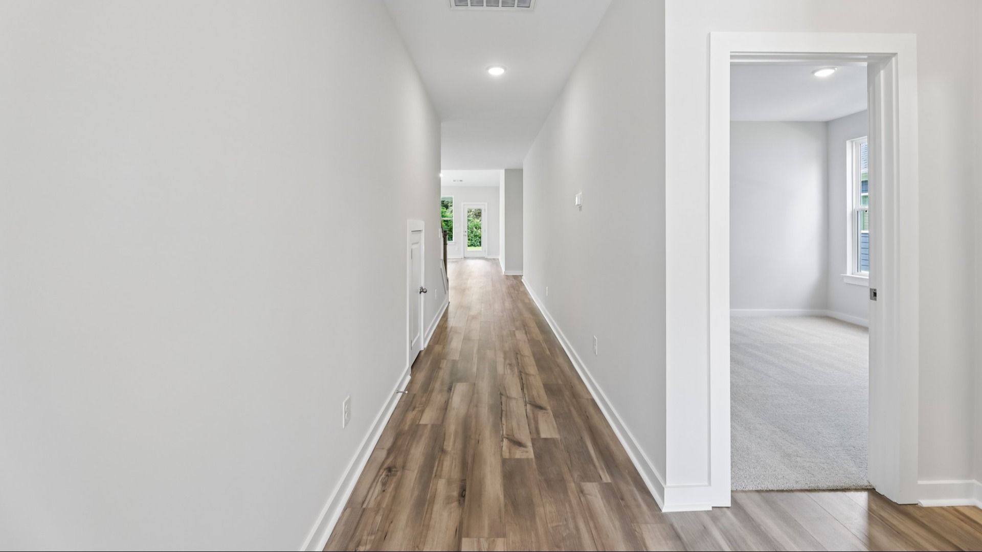 Hallway with view into bedroom