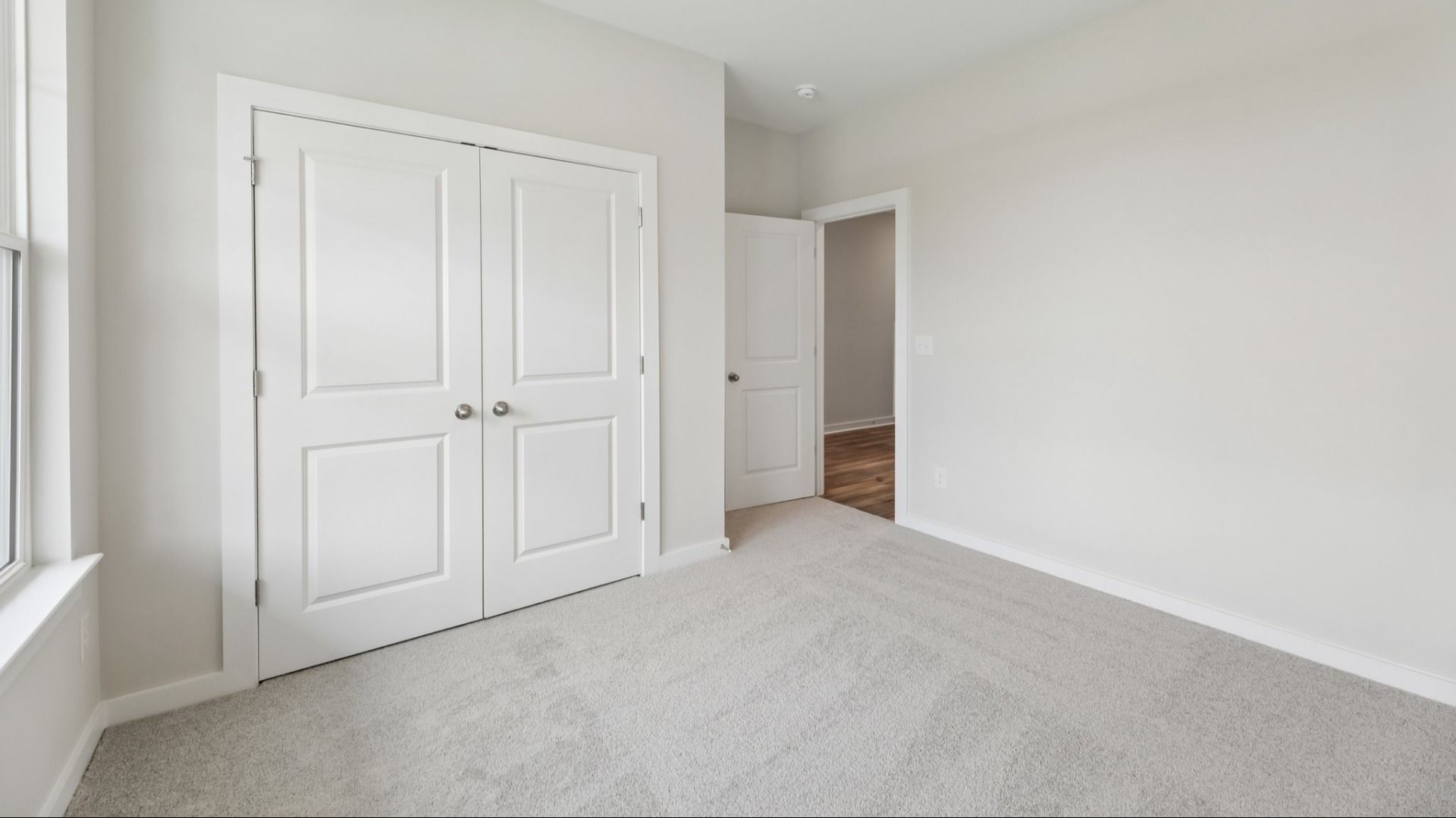 Bedroom with carpet and closet