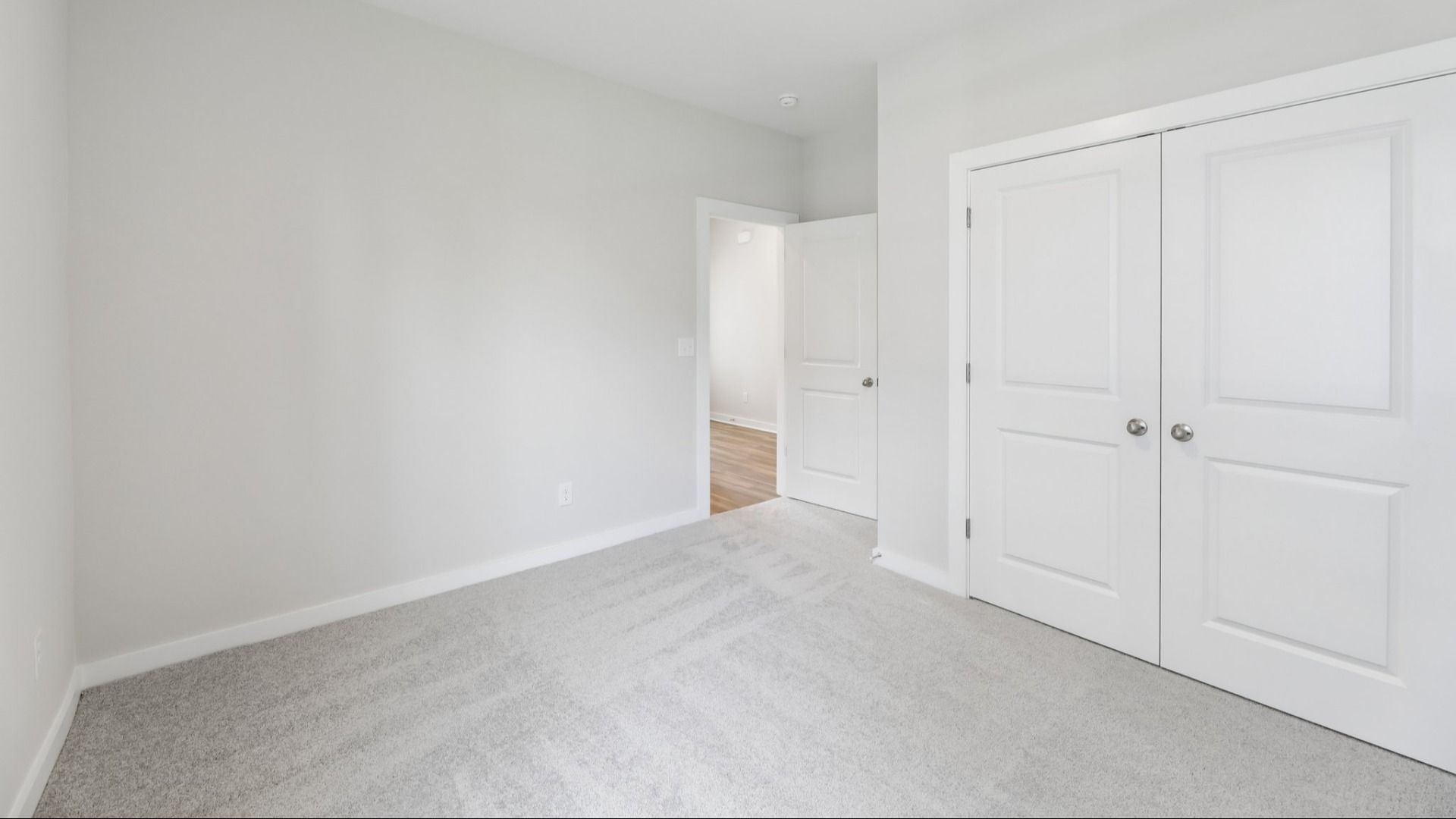 Bedroom with carpet and closet