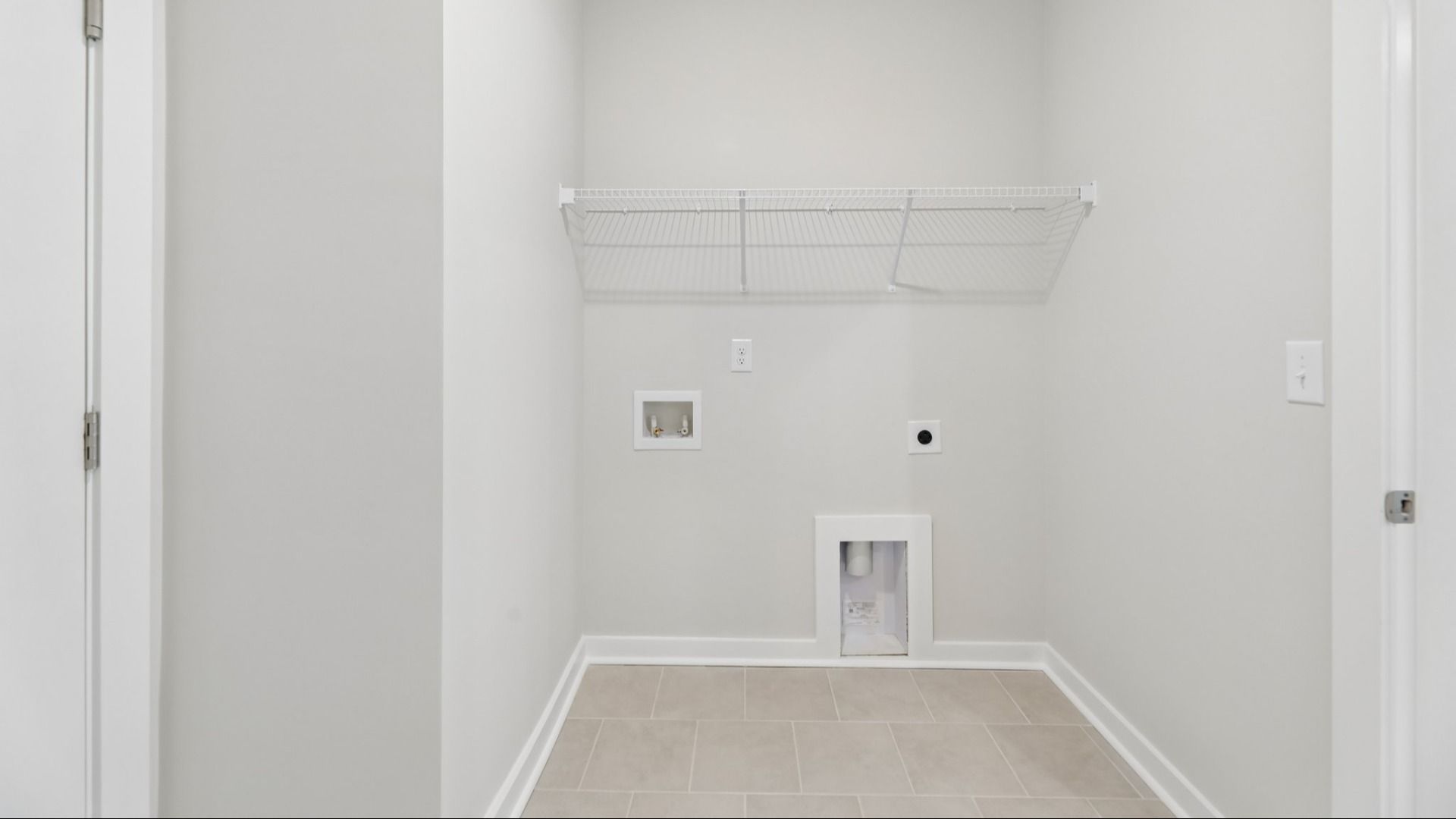 Dedicated laundry room with ventilated shelf