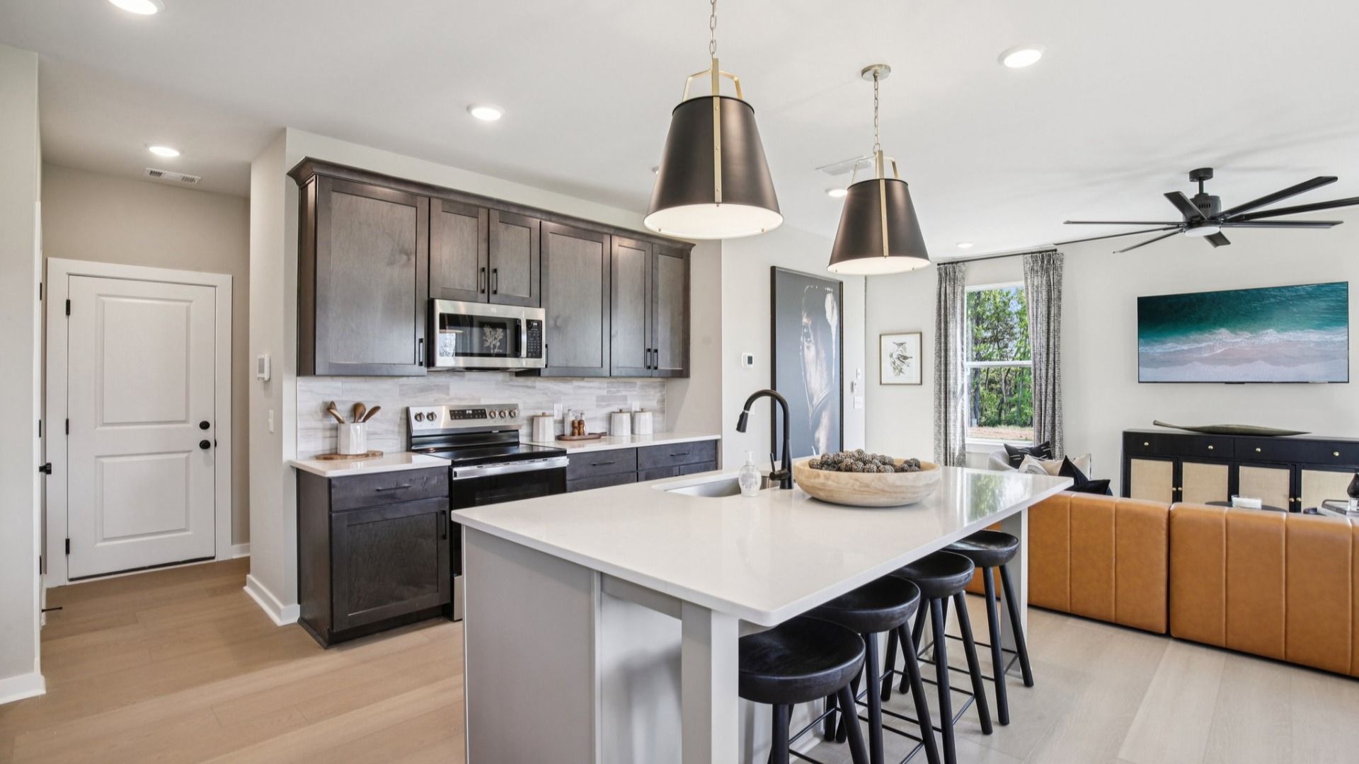 Kitchen with quartz countertops, pendant lighting, and hard-surface flooring