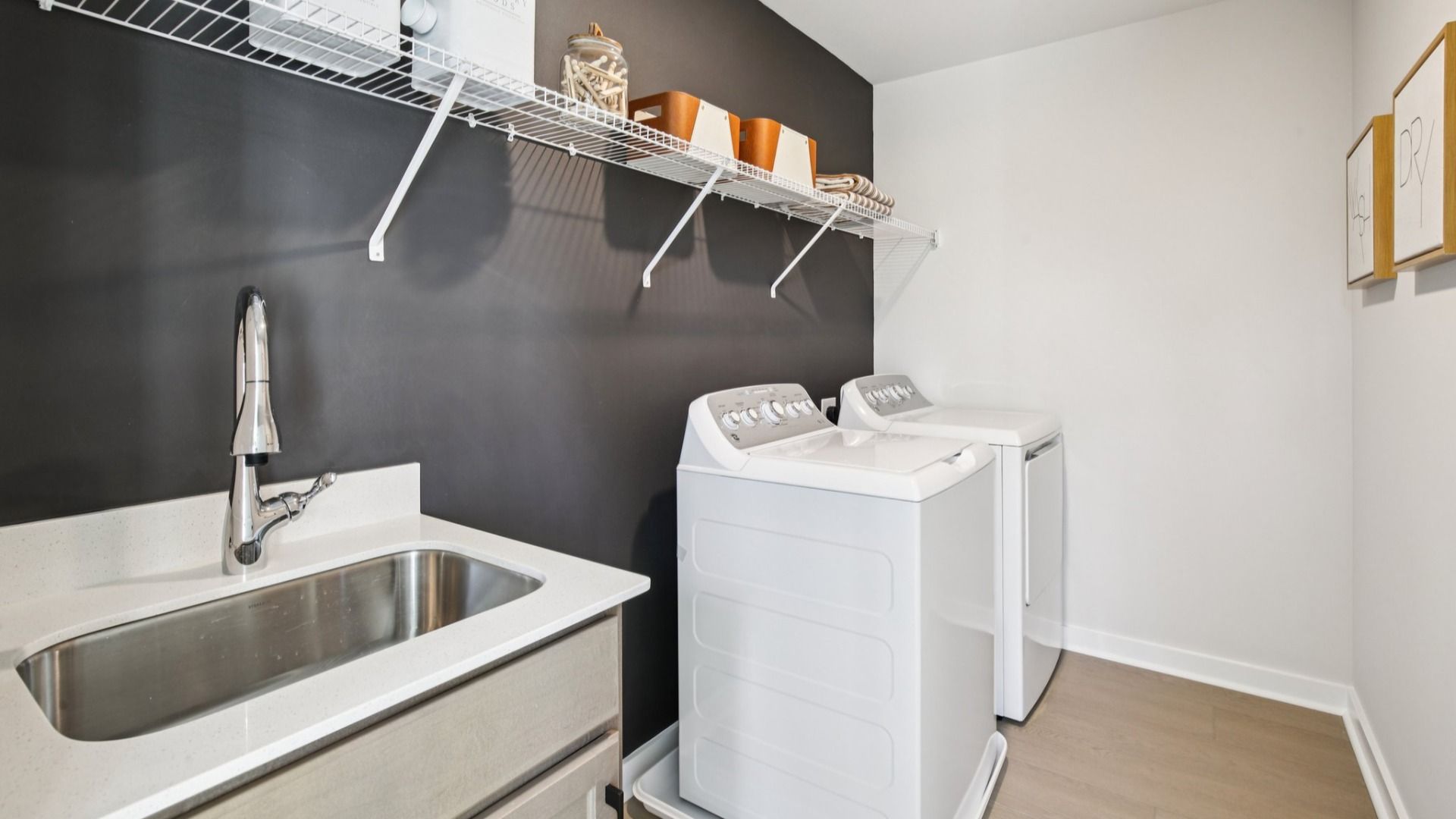 Dedicated laundry room with ventilated shelf
