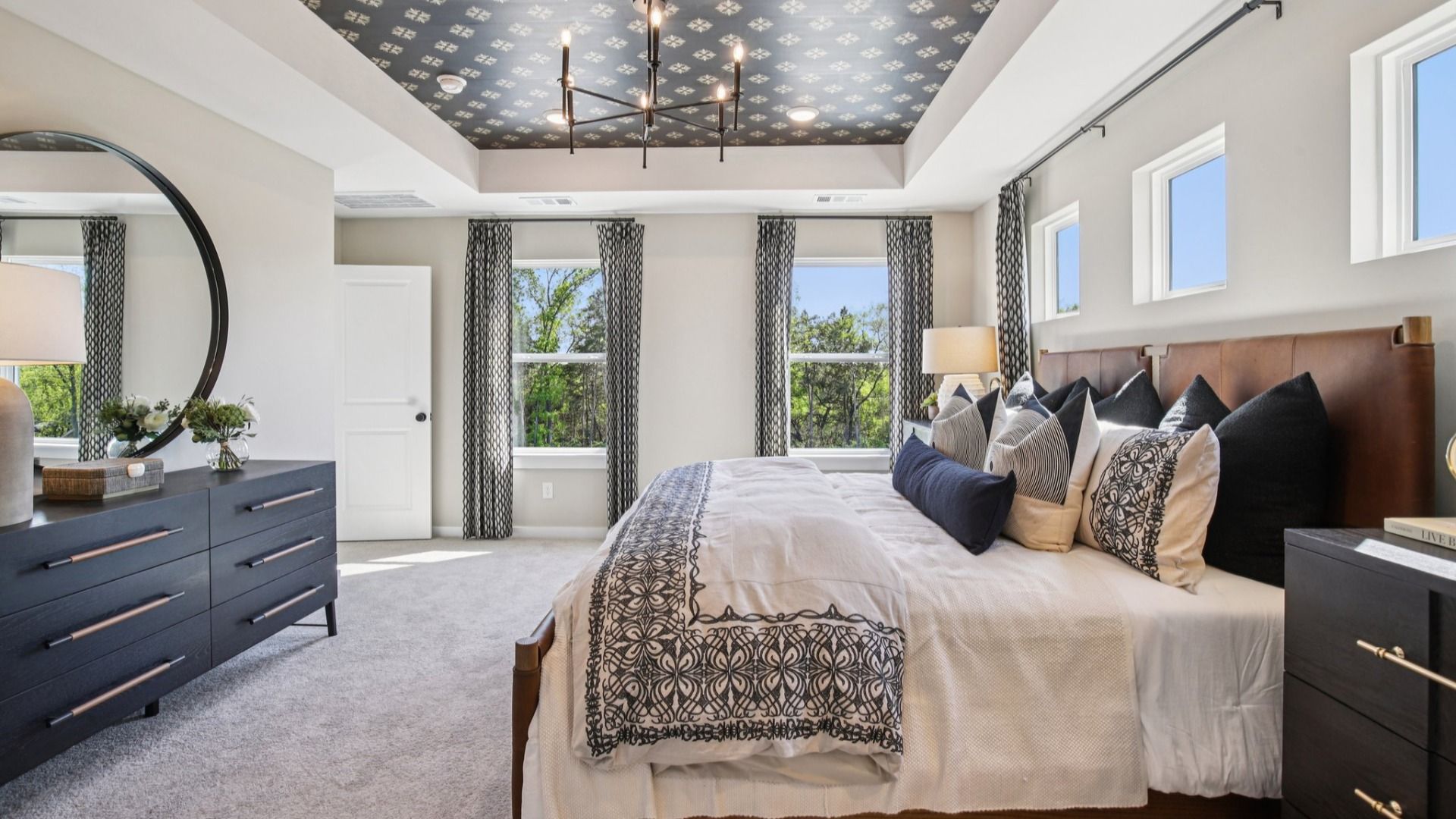 Bedroom with carpet and natural lighting from windows