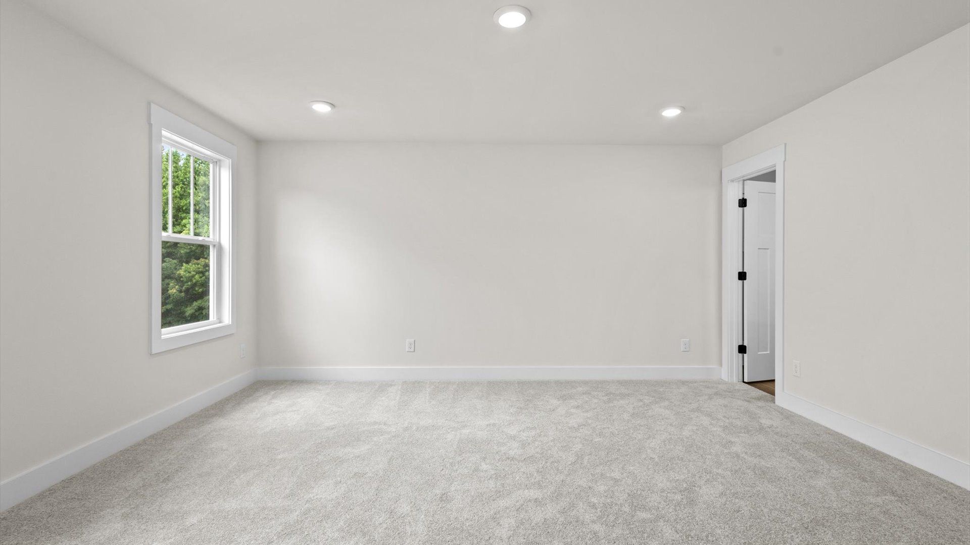 Bedroom with carpet and windows