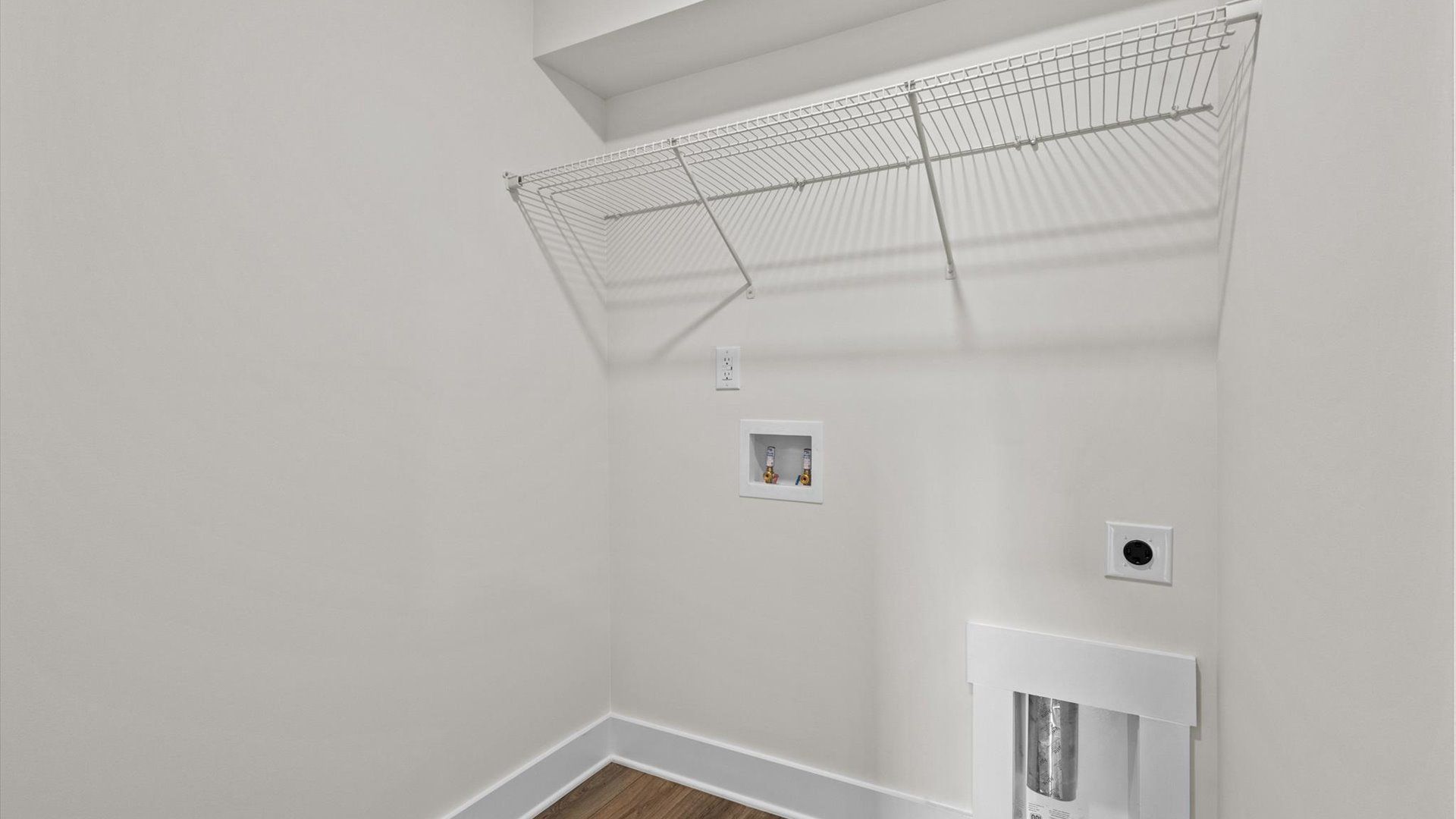 Laundry room with ventilated shelf