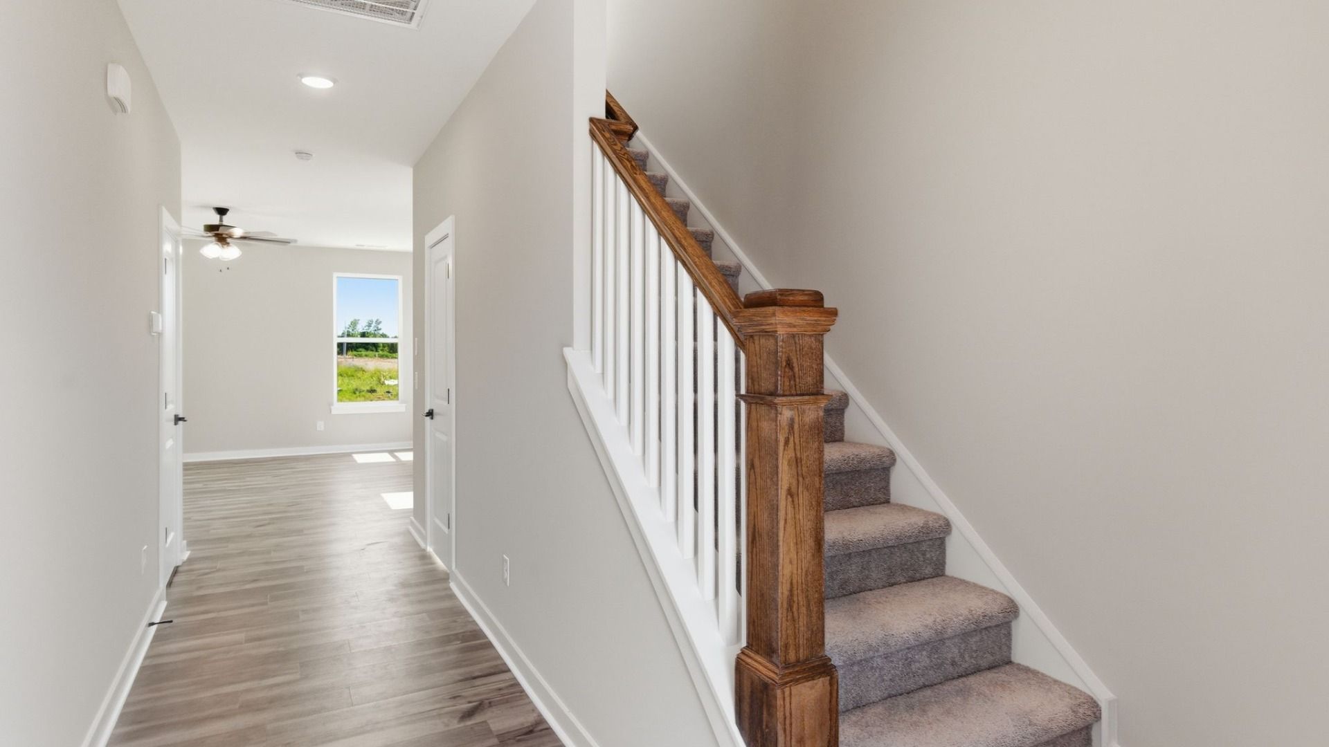 Hallway with access to stairs