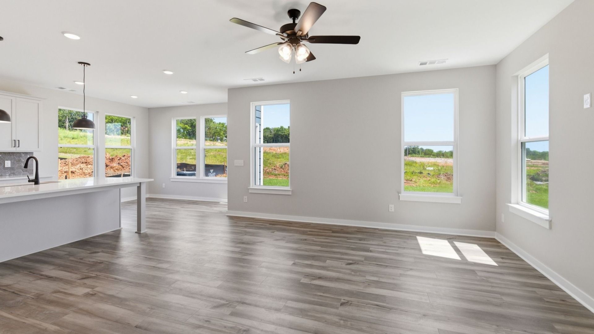 Gathering room with hard surface flooring and ceiling fan